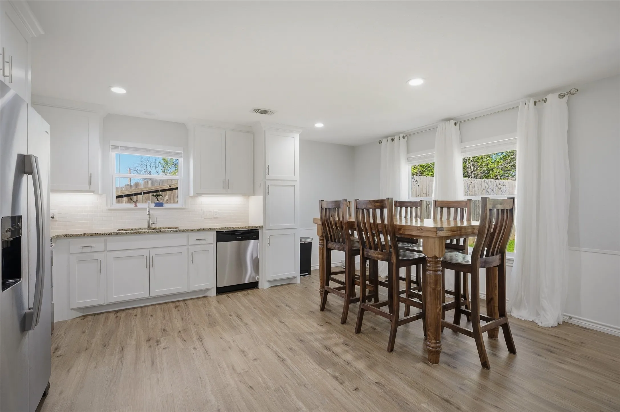 Plenty of cabinet and counter space in the kitchen and room for a large dining table and chairs.