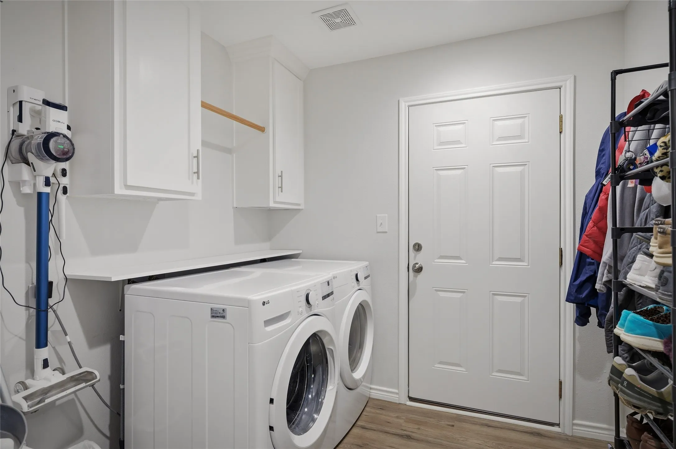 Separate full-size laundry room with built in cabinetts.