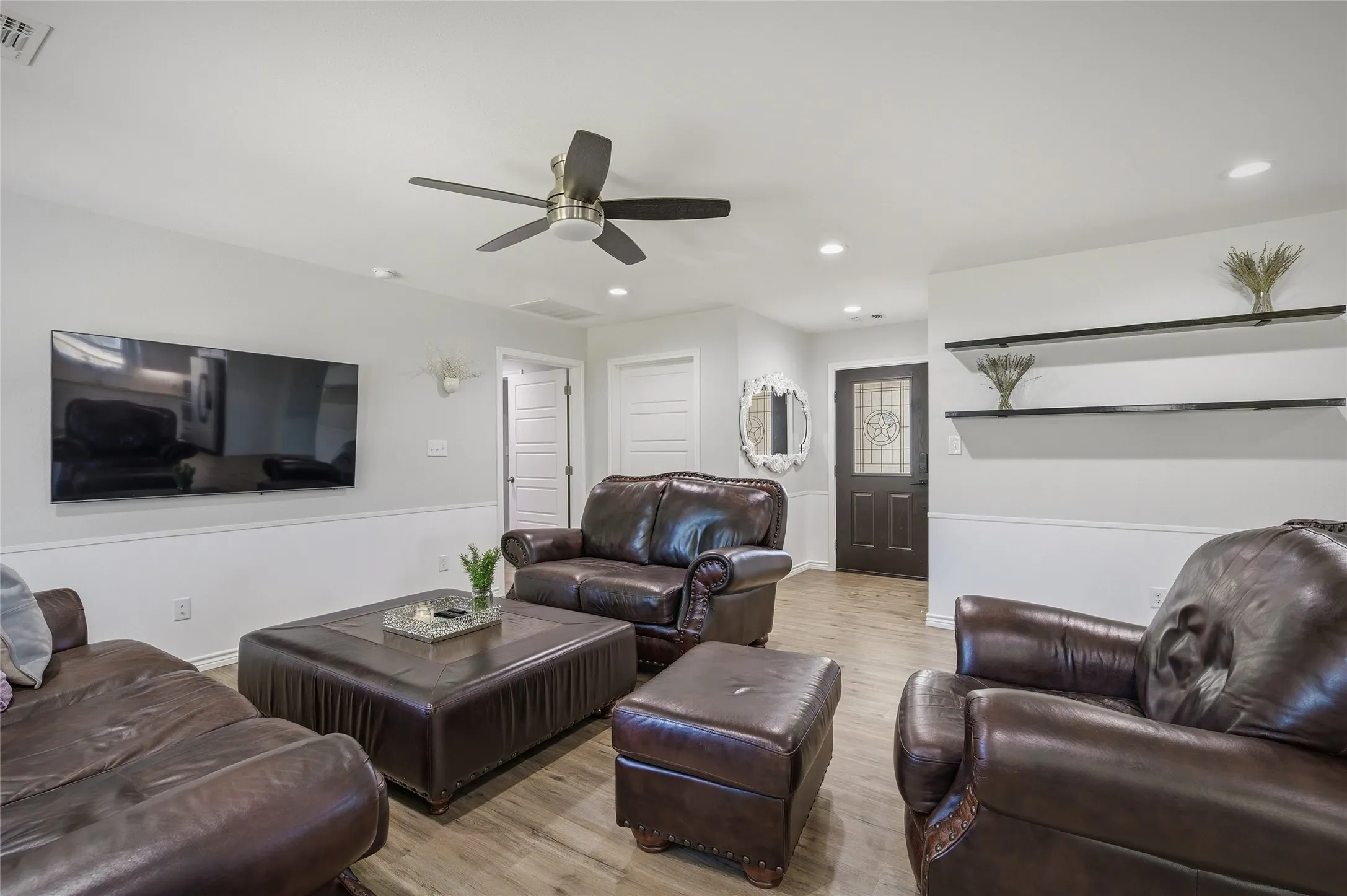Large living area accommodates multiple layouts with room for family and/or guests.
