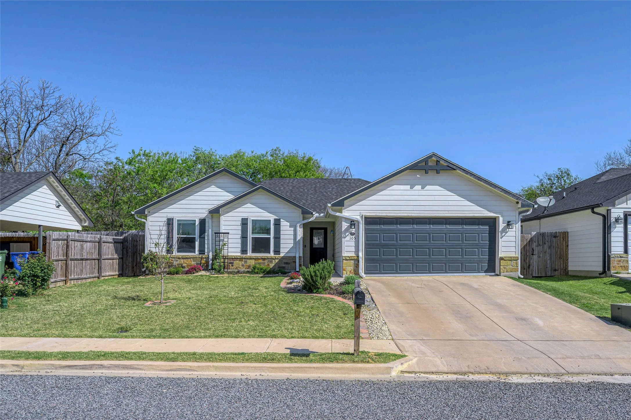 Landscaped front yard on a quiet street just south of downtown Whitesboro.