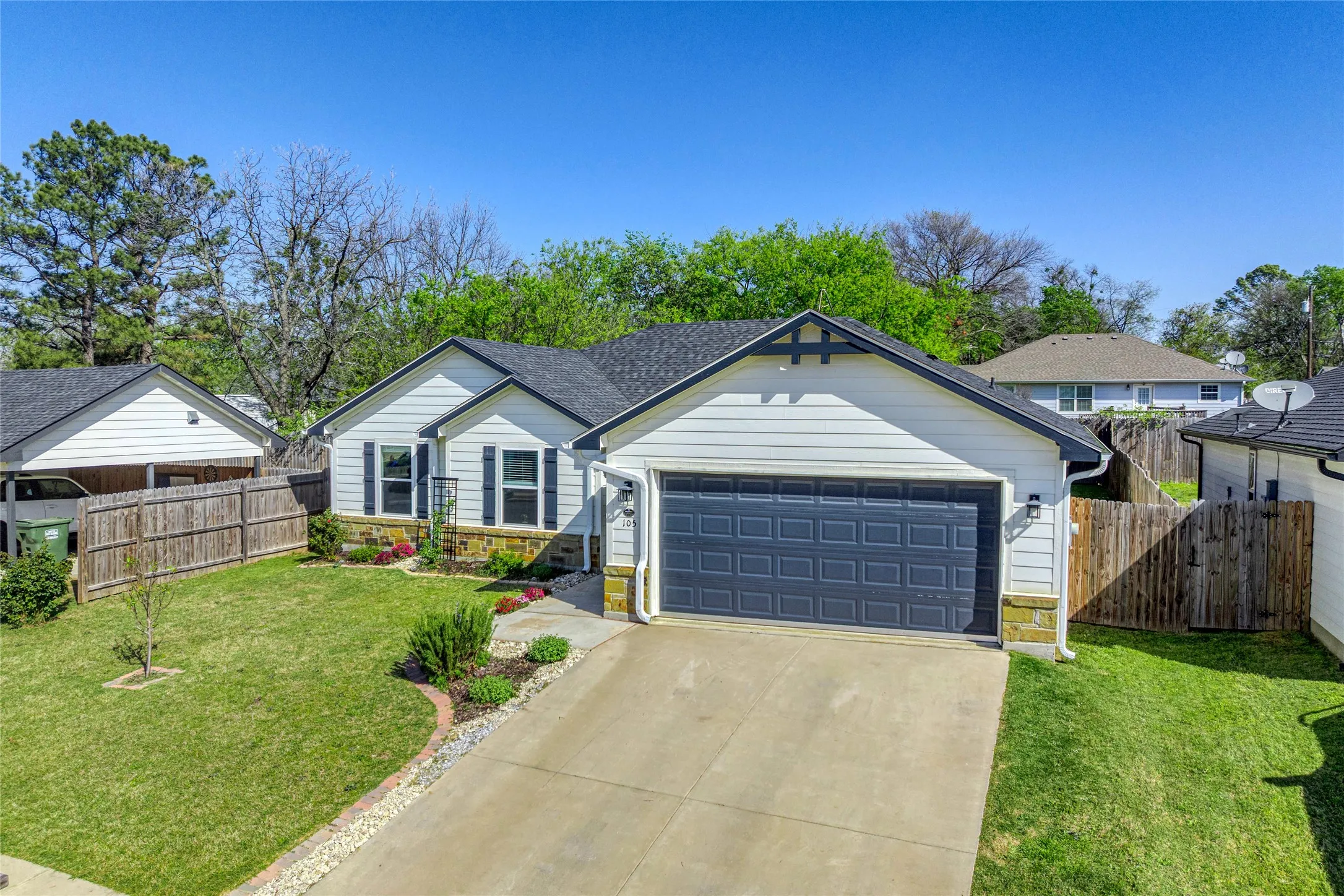 Large driveway provides additional parking for family and friends.