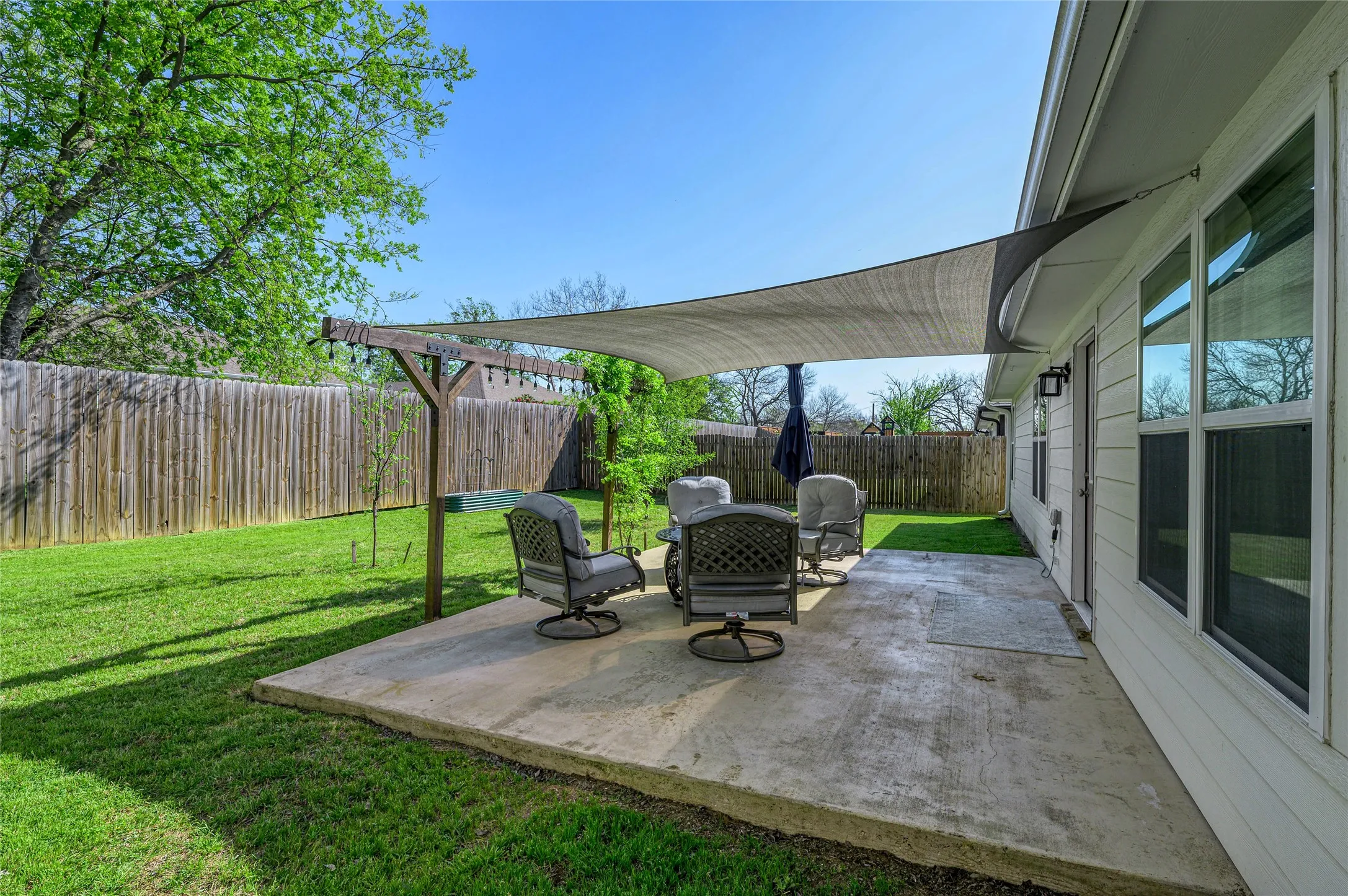 Large patio with shade cover is perfect for enjoying a relaxing evening and the Texas sunset.