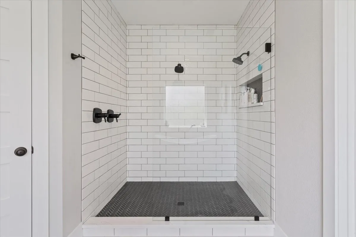 Full bathroom with a shower stall