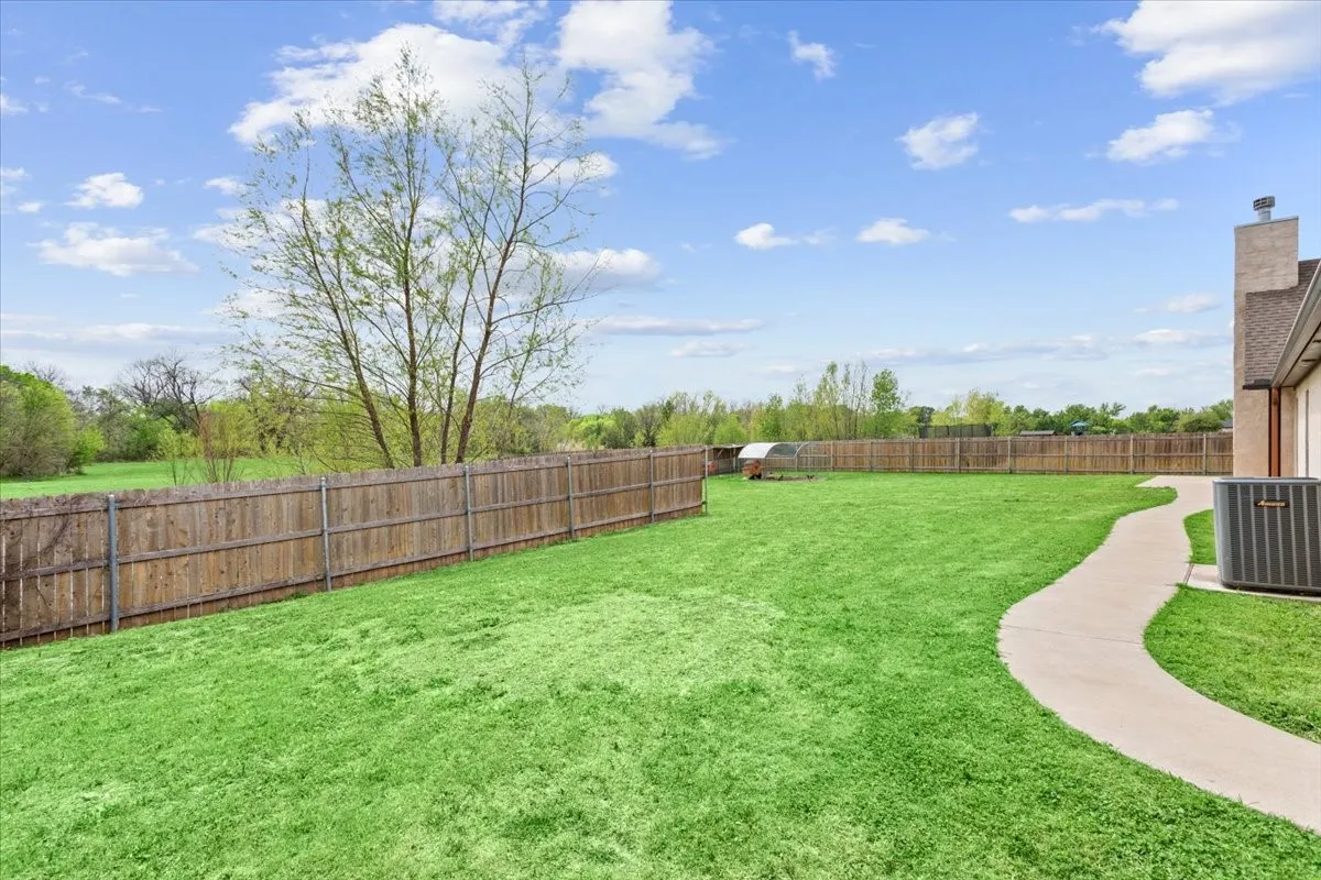 View of fenced backyard