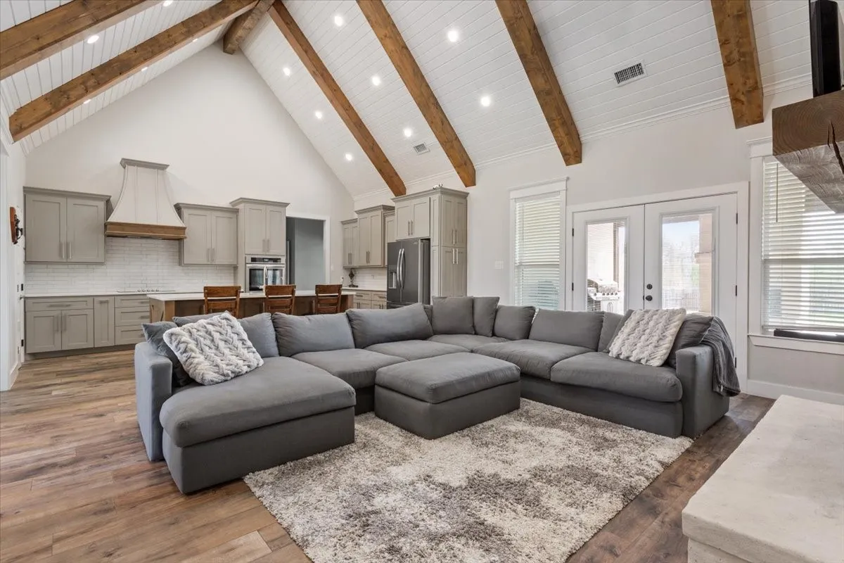 Living area with french doors and dark wood-type​​‌​​​​‌​​‌‌​‌‌​​​‌‌​‌​‌​‌​​​‌​​ flooring
