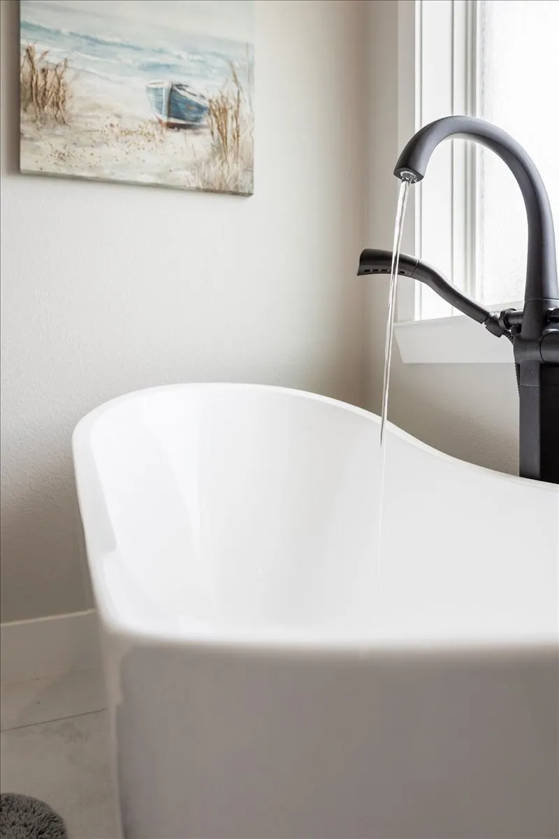 Bathroom view of a soaking tub and a sink