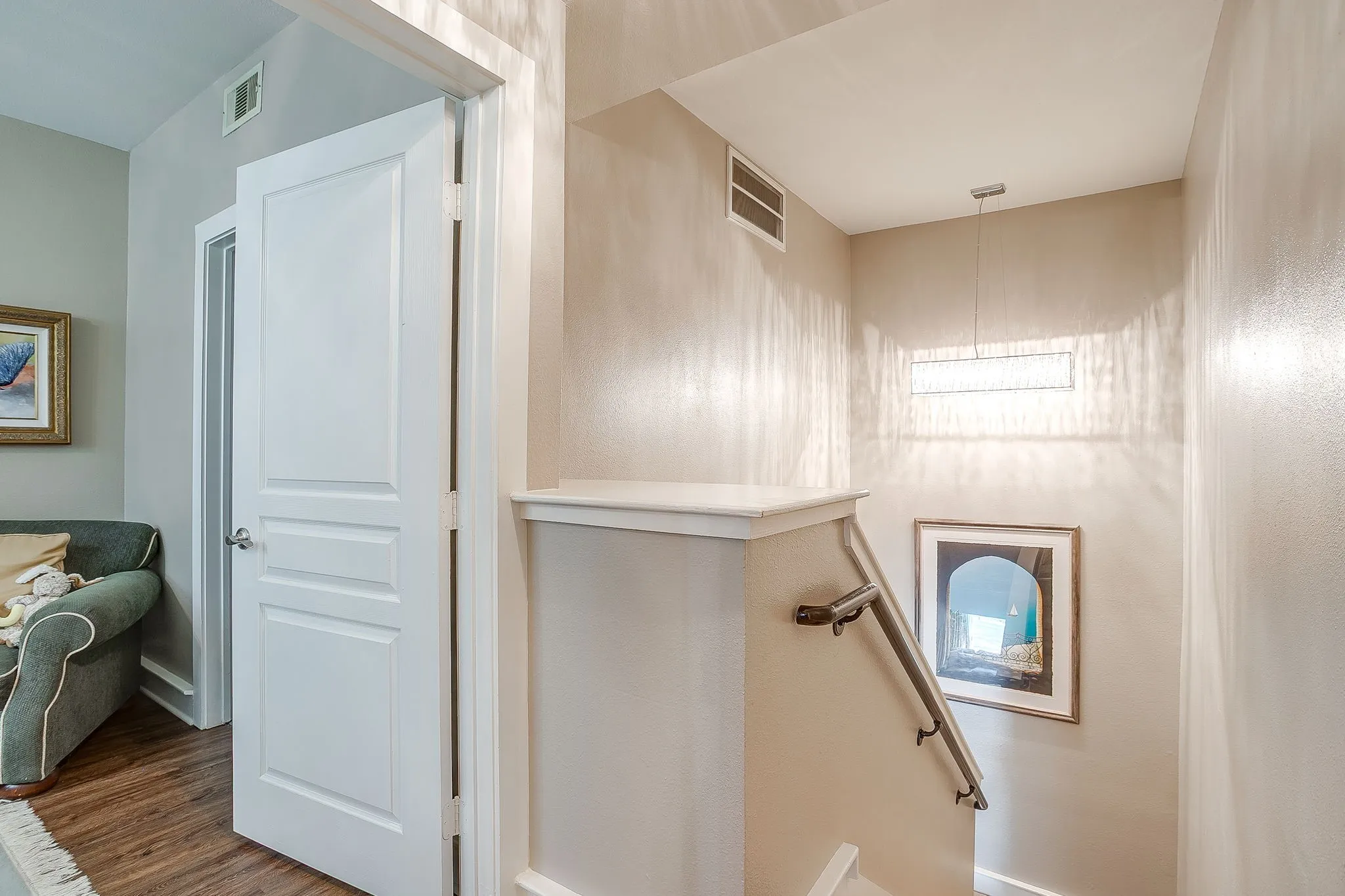Stairway featuring wood finished floors and baseboards