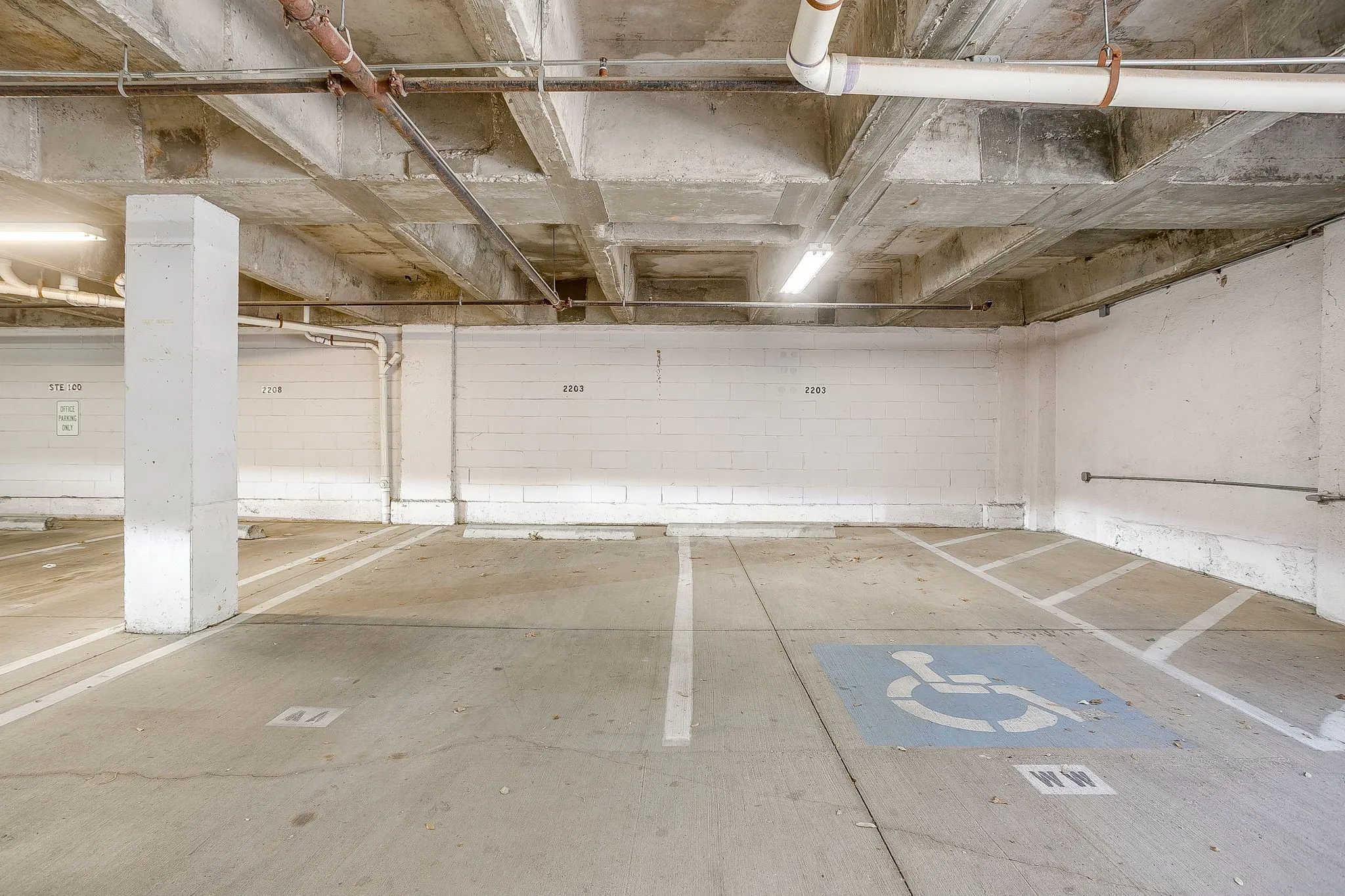 Garage featuring a parking garage
