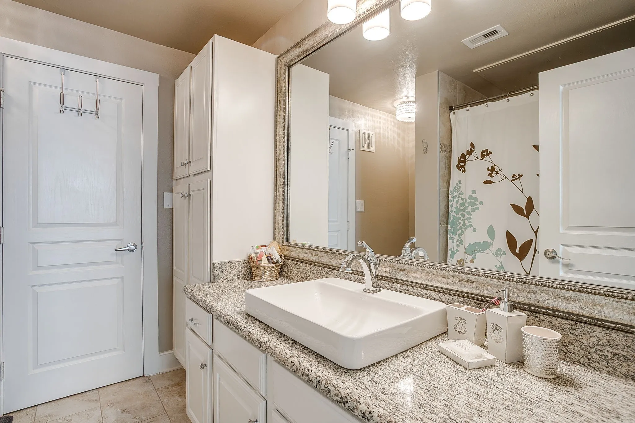 Bathroom with vanity and curtained shower