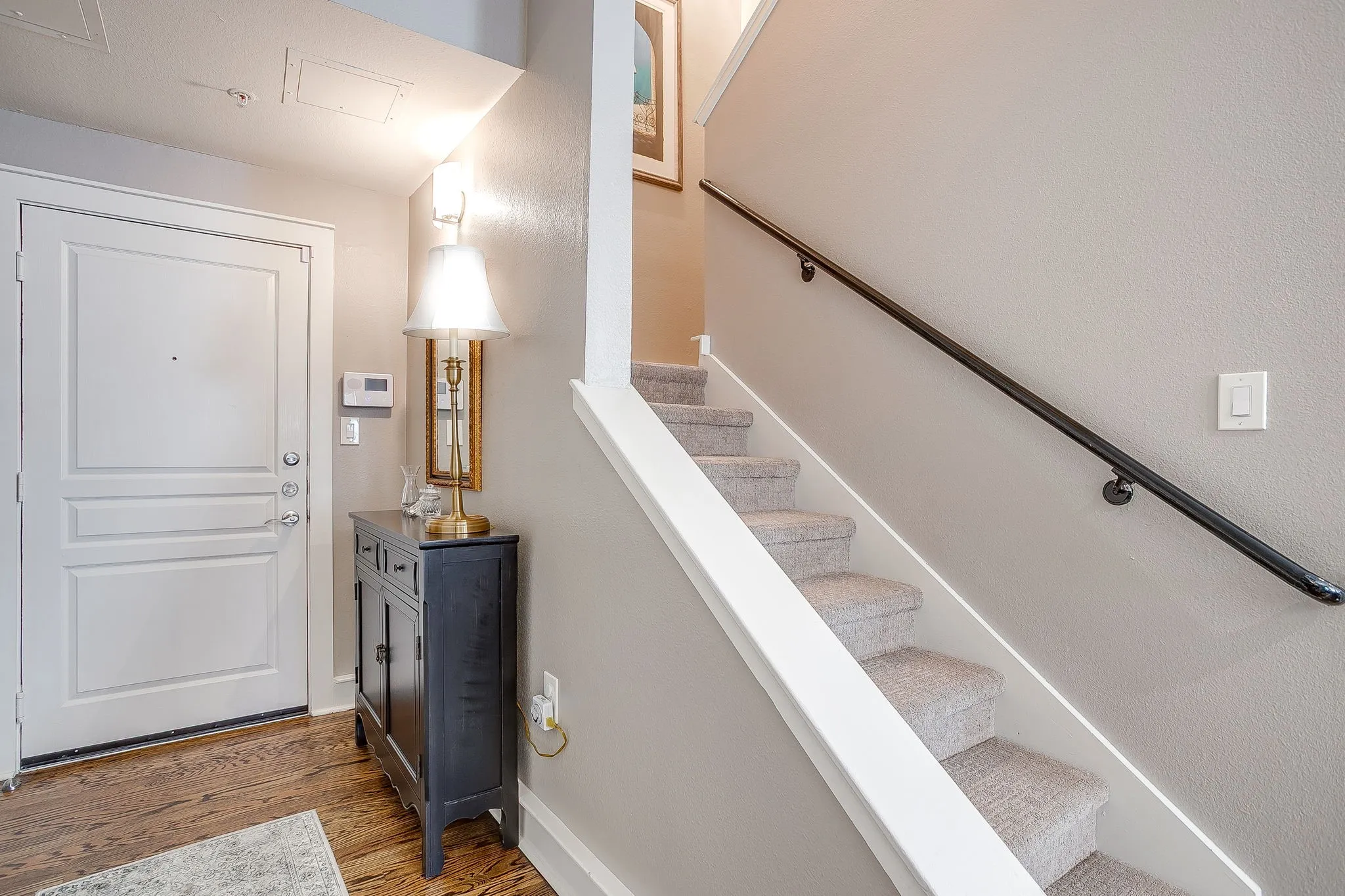 Entrance foyer with stairway and light wood finished floors
