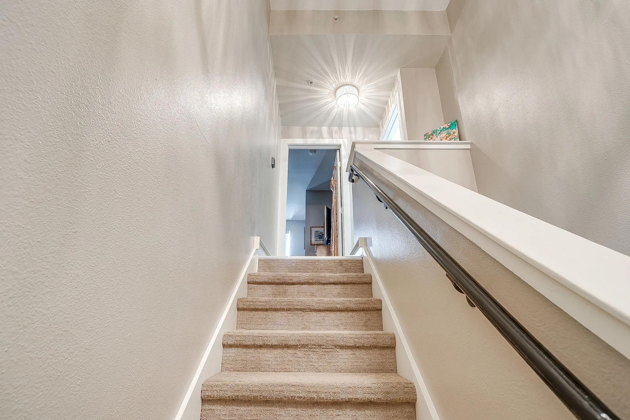 Stairway featuring a textured wall