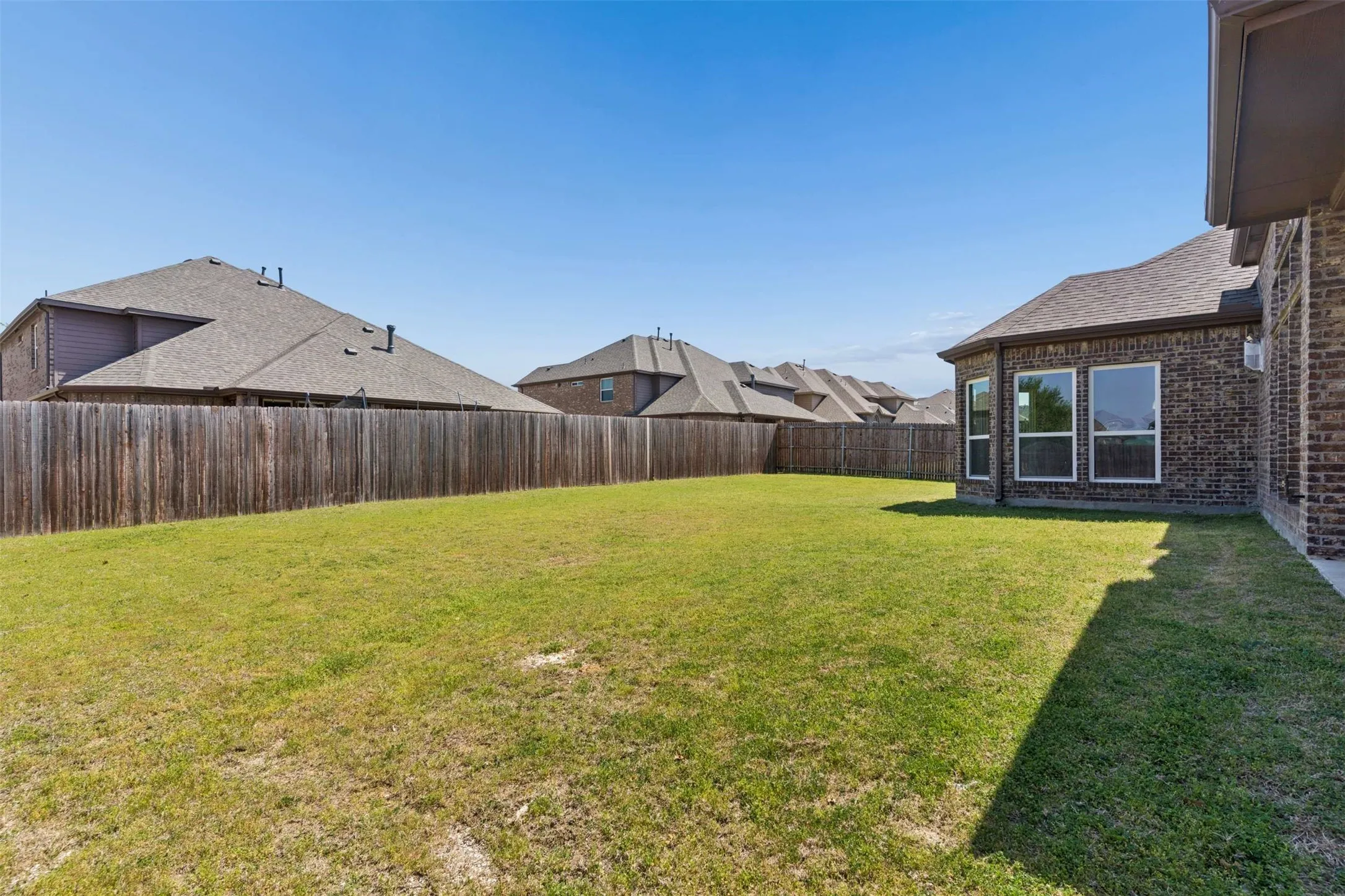 View of fenced backyard