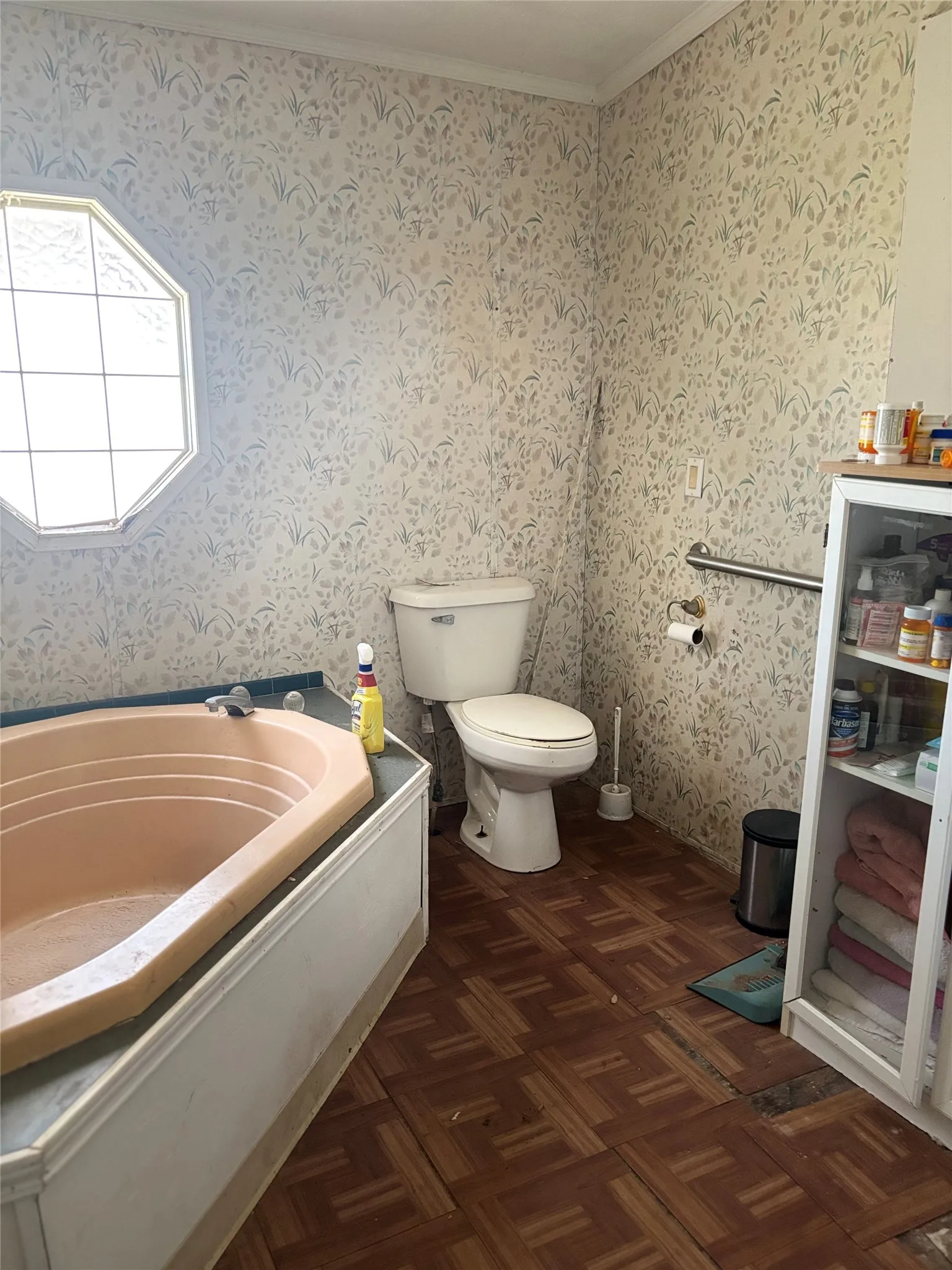 Full bath featuring a bath, parquet flooring, and ornamental molding