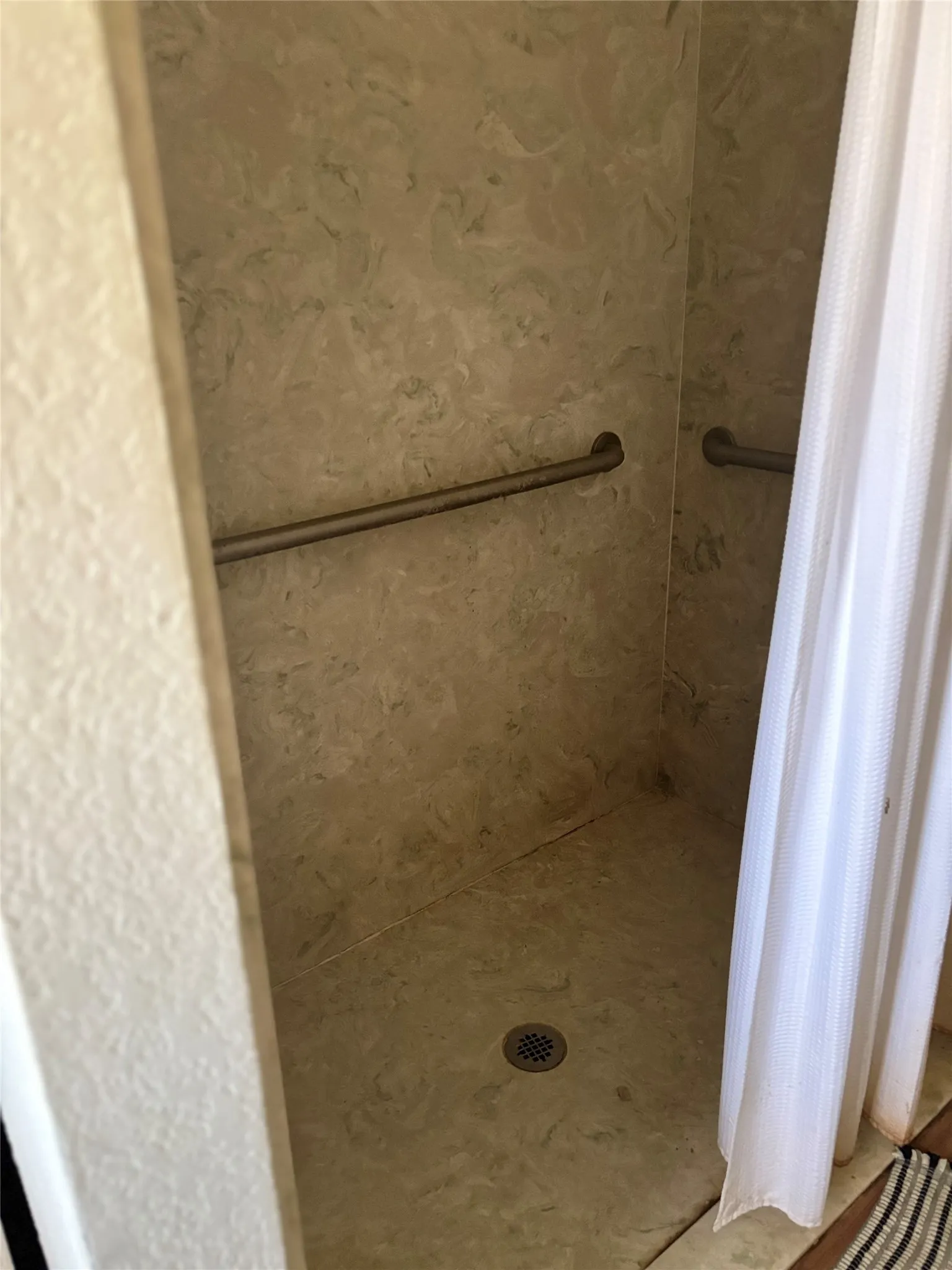 Full bath with a shower stall