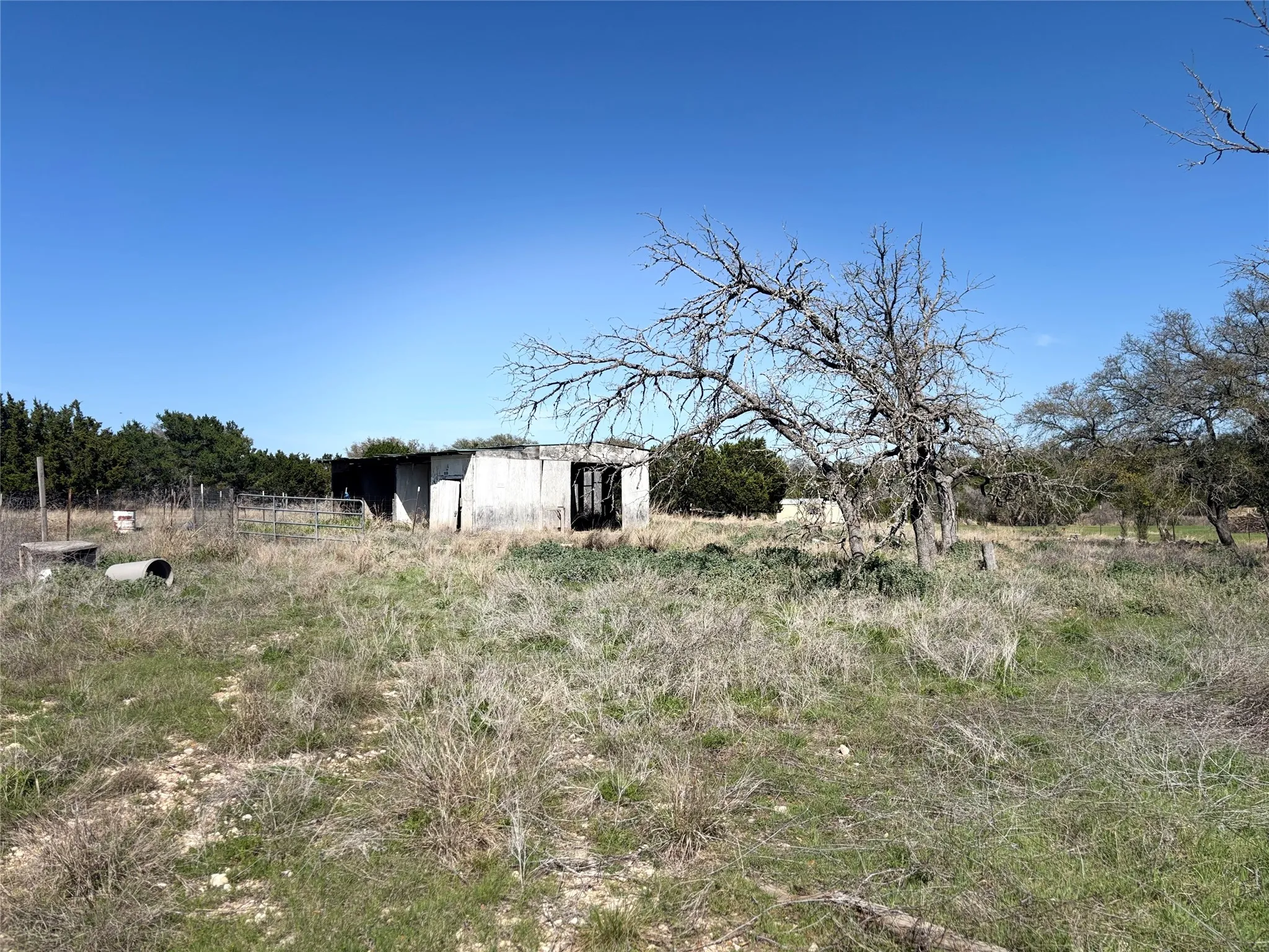 View of yard featuring a view of countryside and an outdoor structure