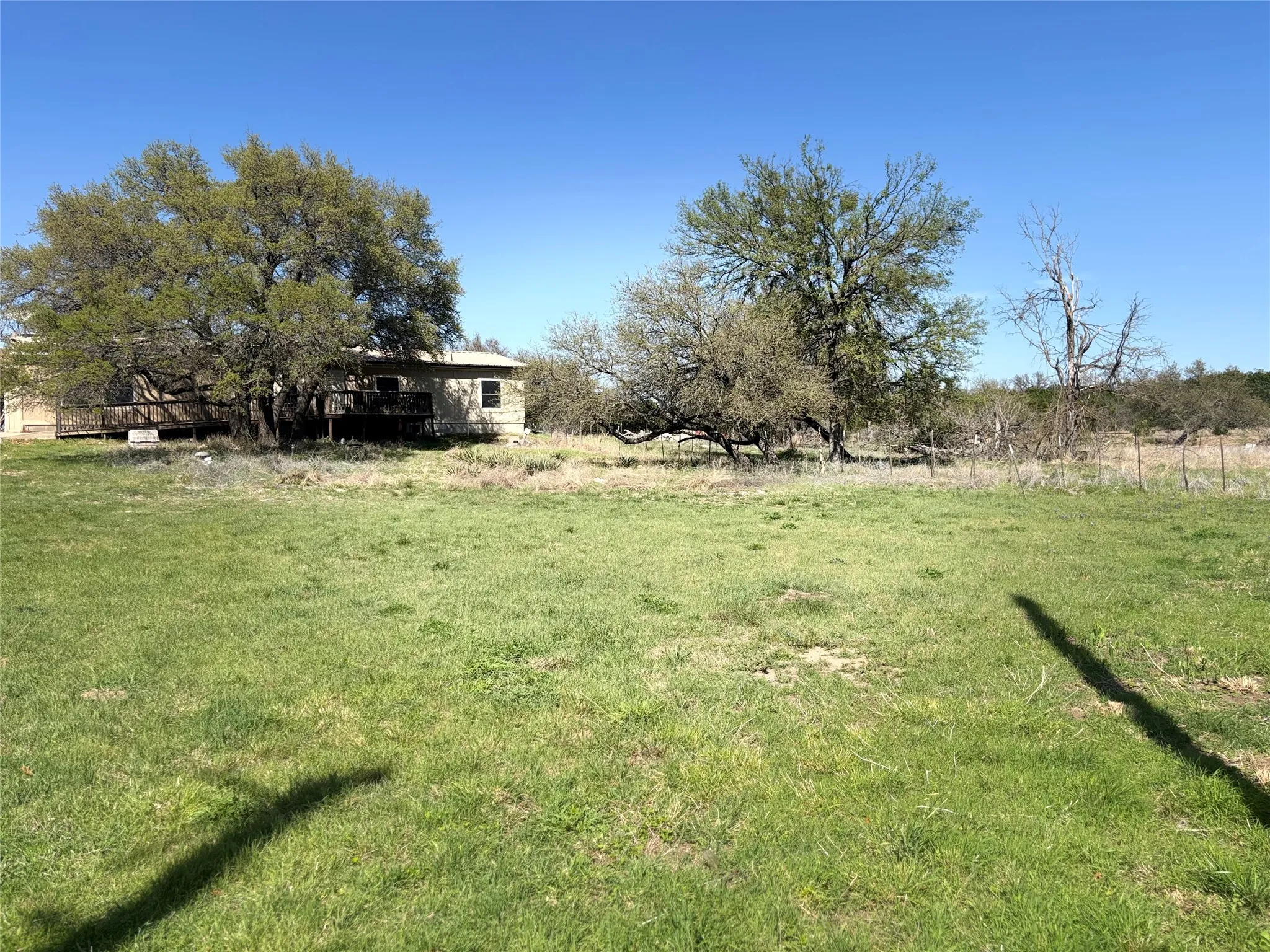 View of green lawn with a view of countryside