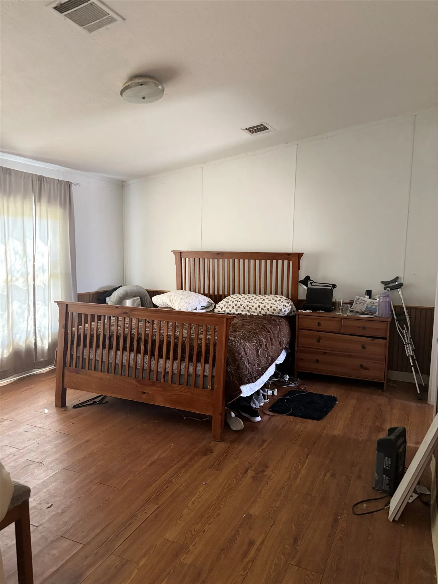 Bedroom featuring dark wood-style flooring