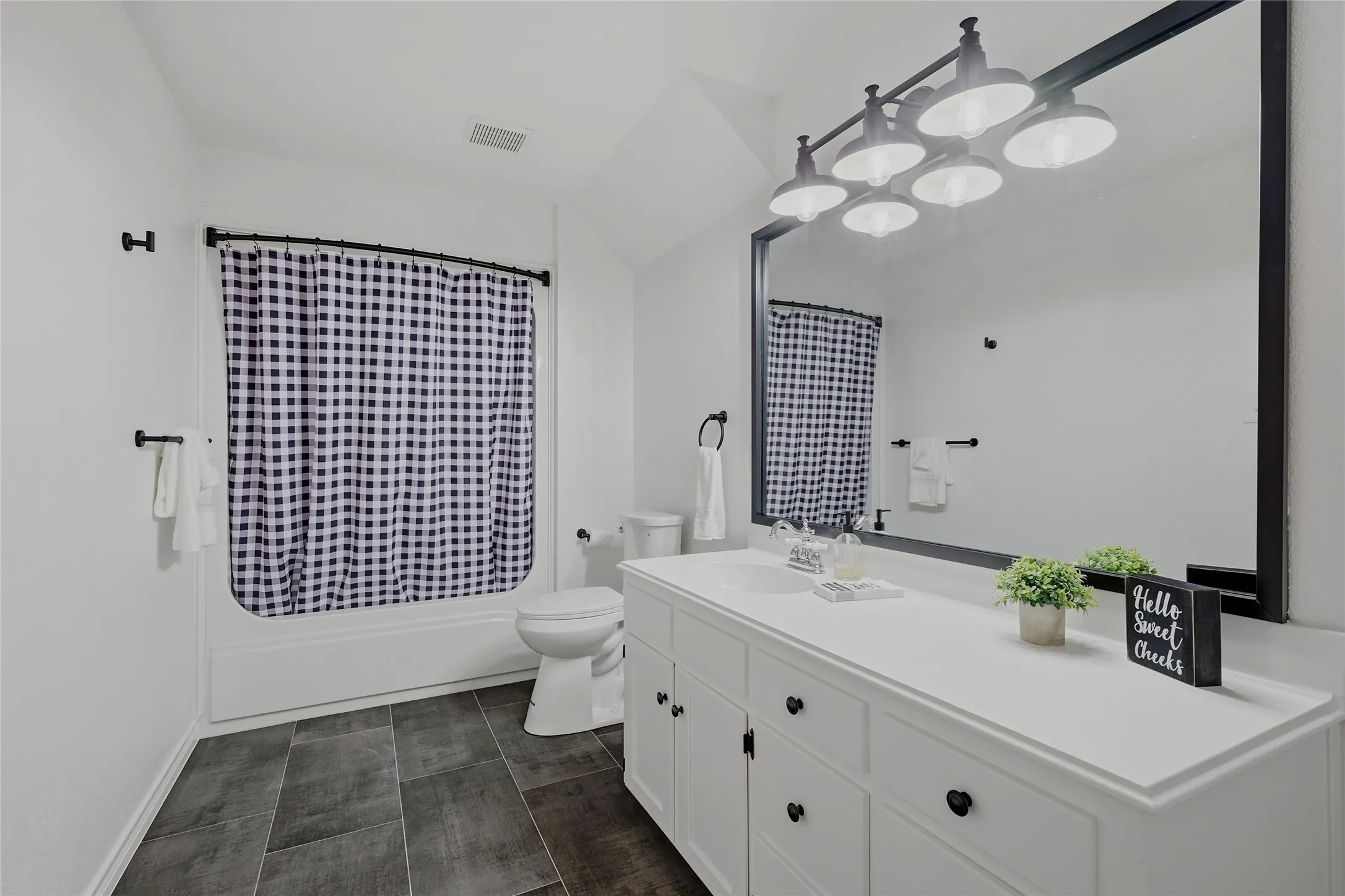 Full bathroom featuring vanity and shower / tub combo