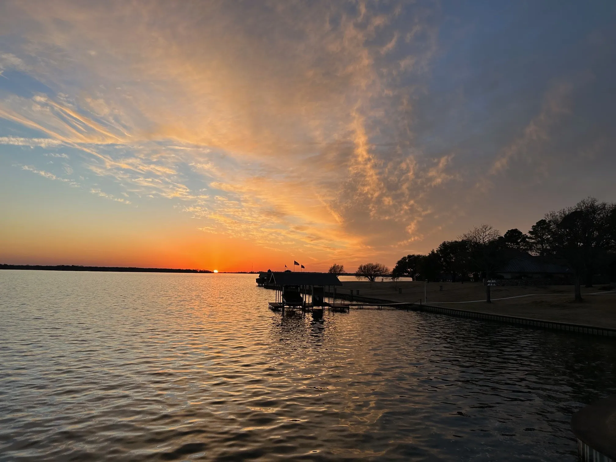 Water view at sunset from boatdock's sundeck