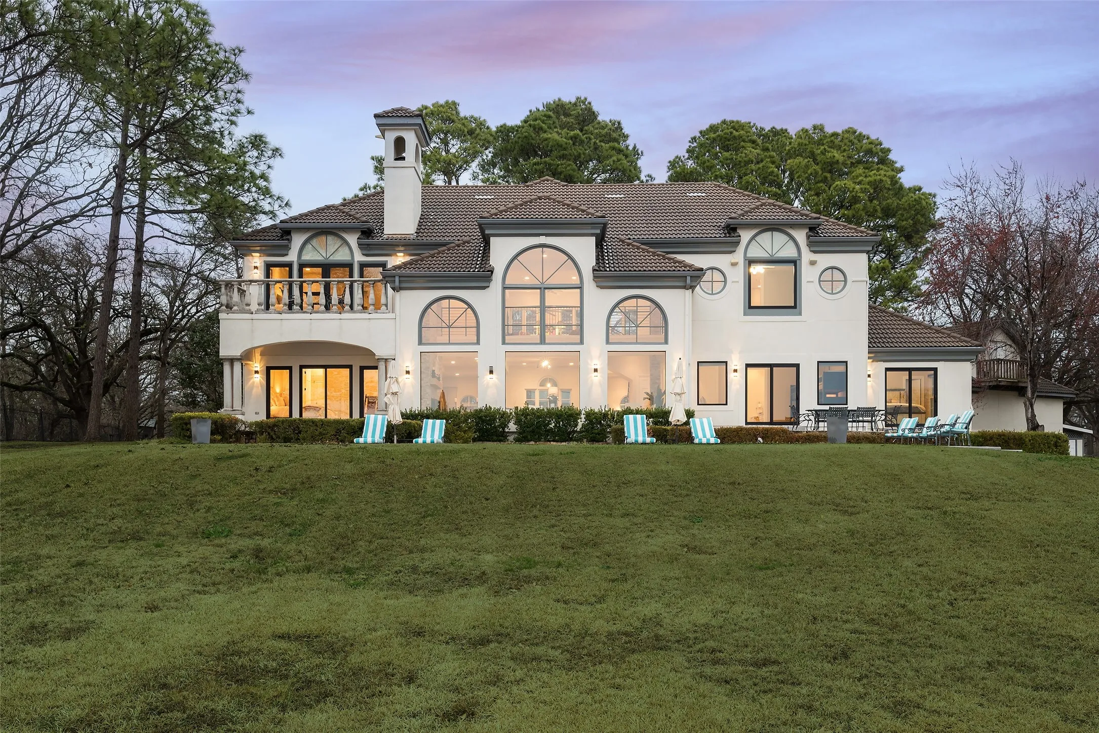 Lawn beyond pool to lake