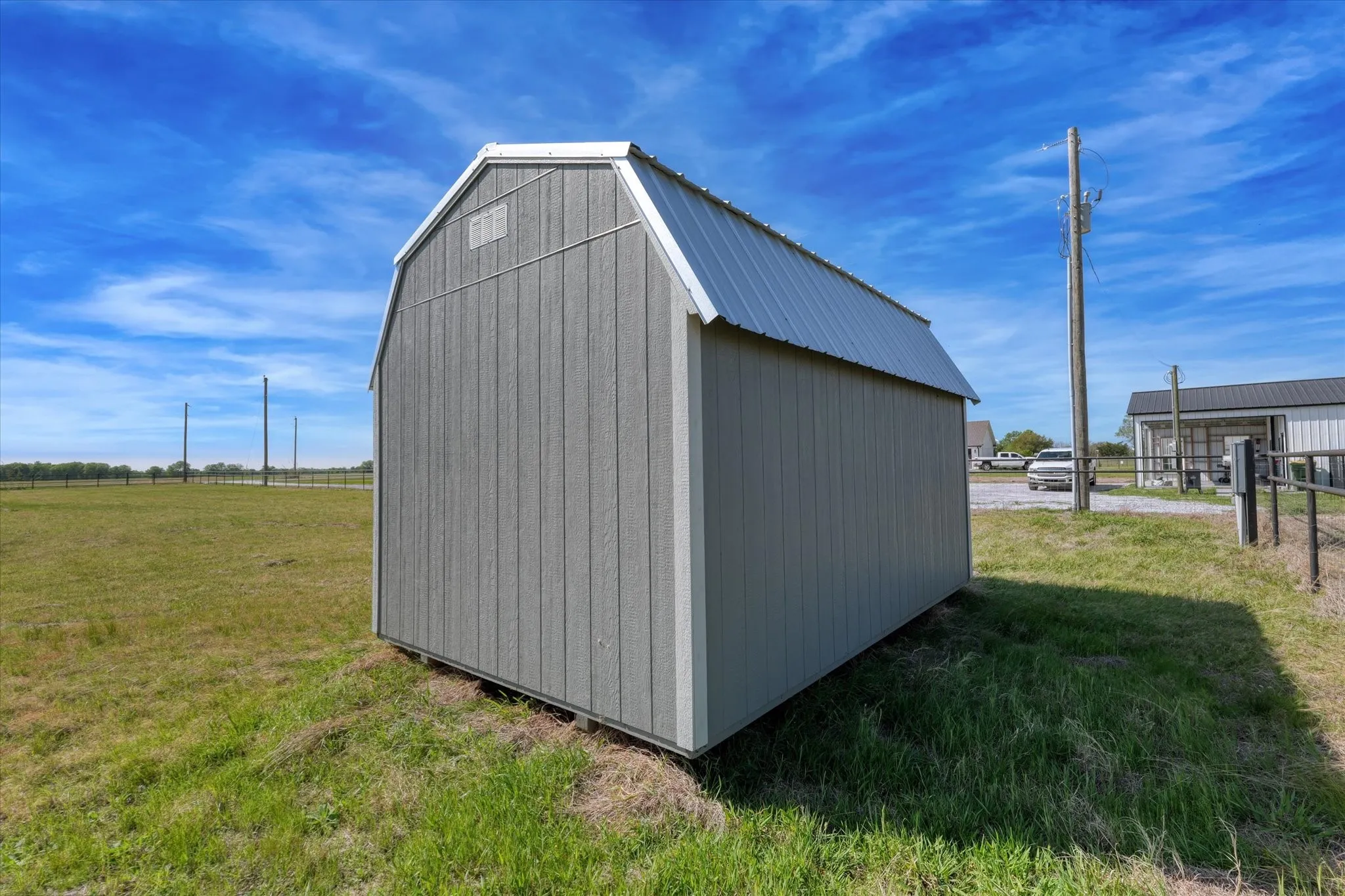 Rear view of shed that stays with property.