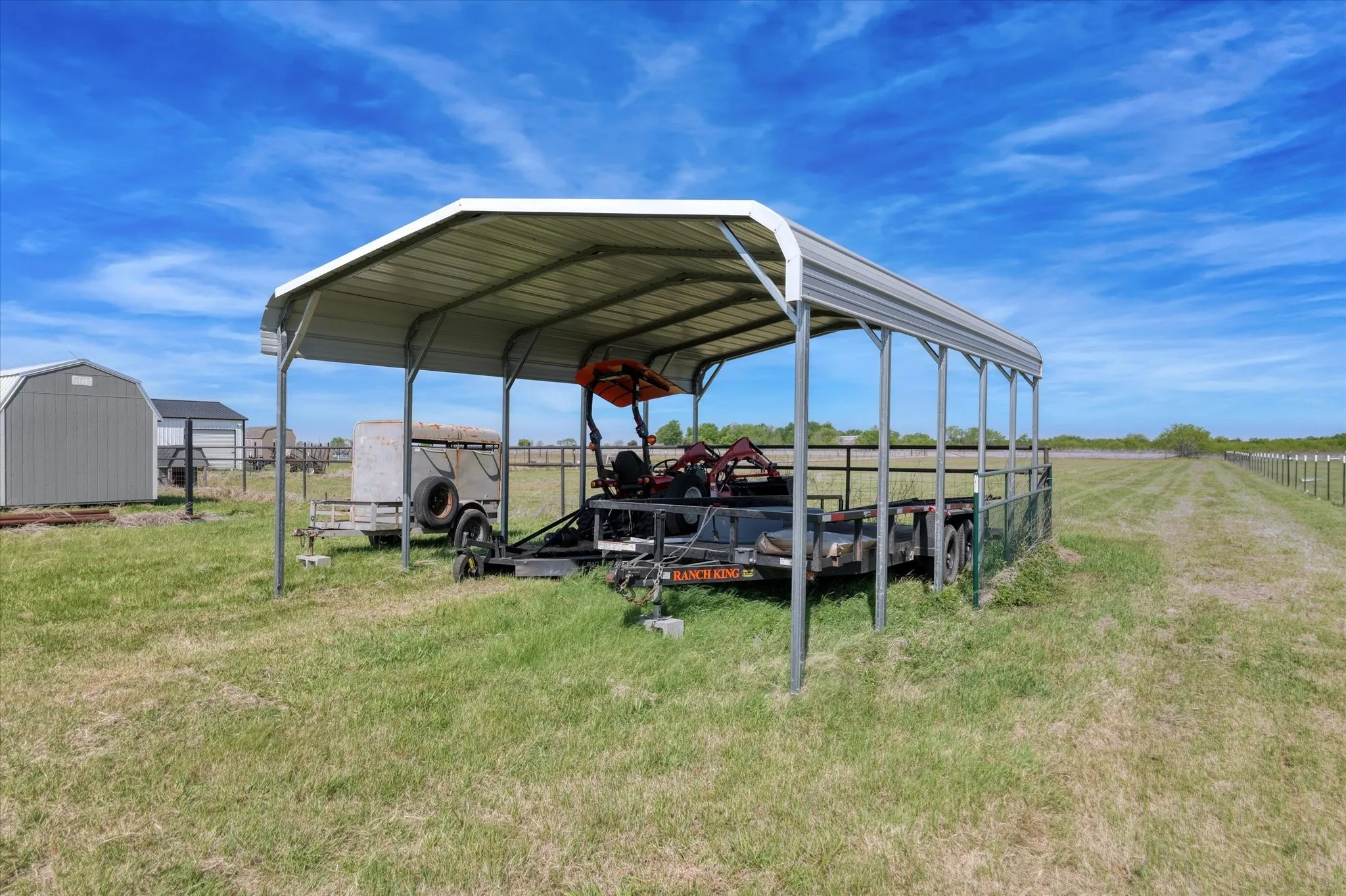 Carport stays with the property, tractor and tailer and personal items do not.