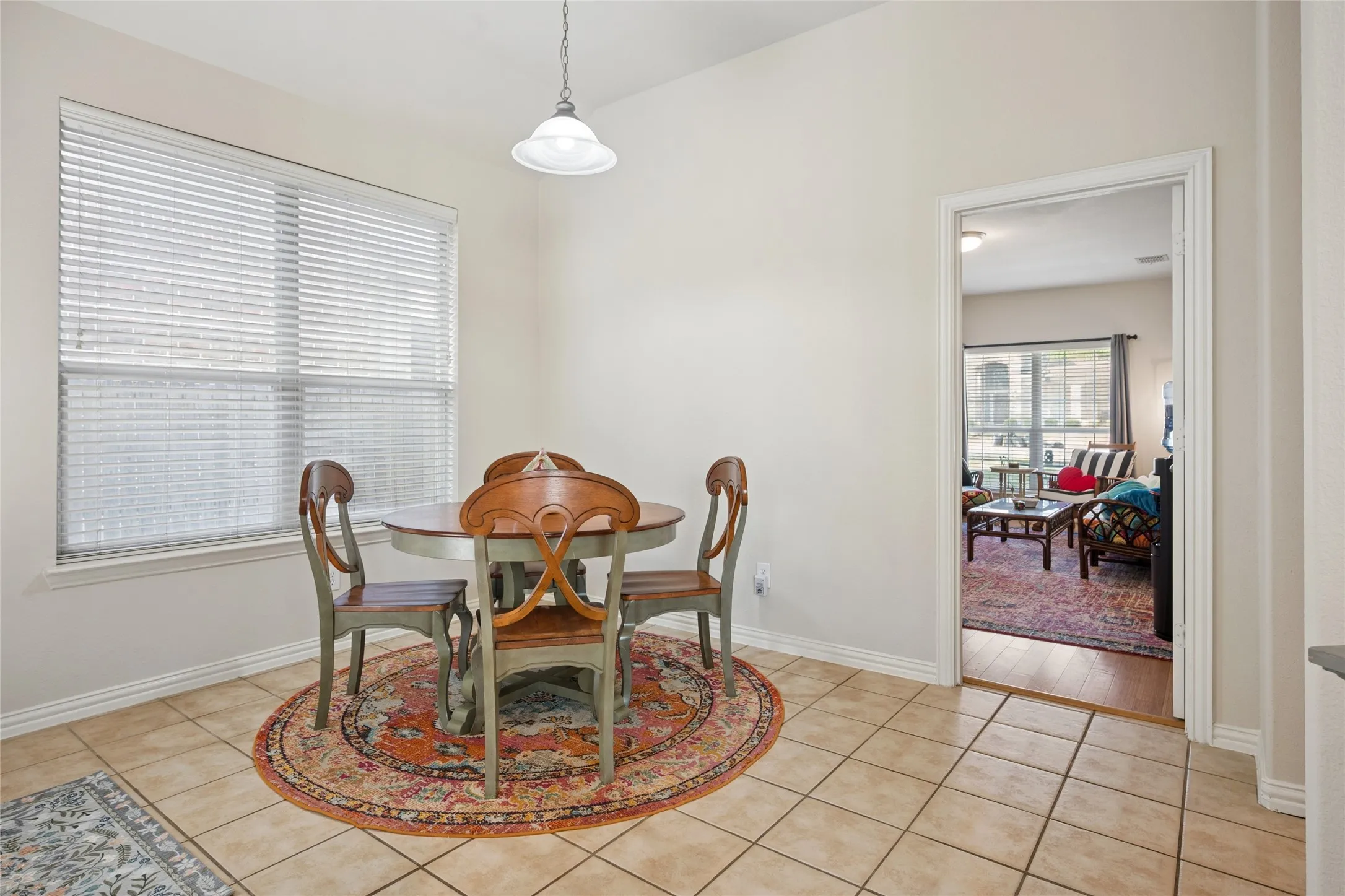 Breakfast area off kitchen with french doors to covered patio