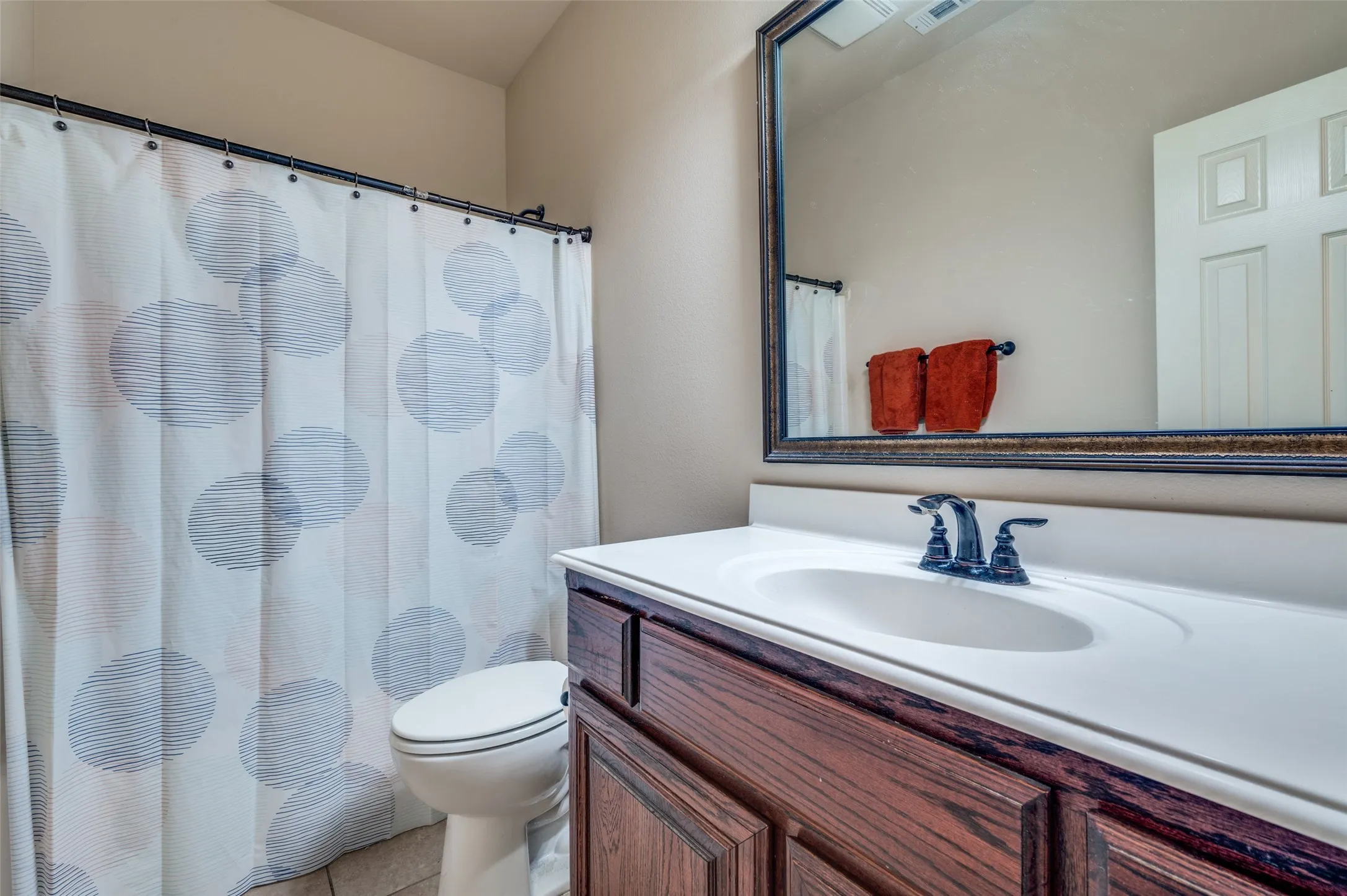 Full bath adjacent to secondary bedroom.