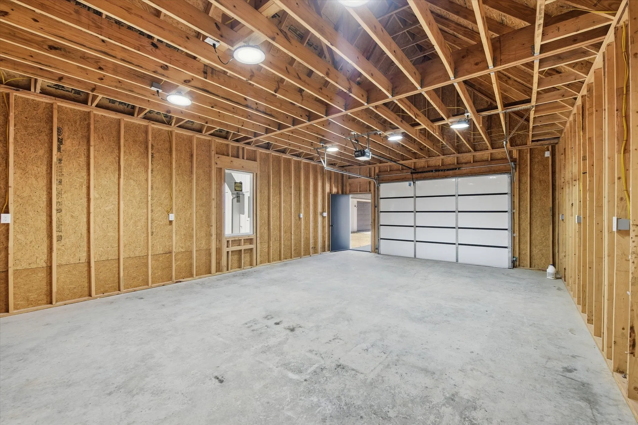 Garage featuring a garage door opener