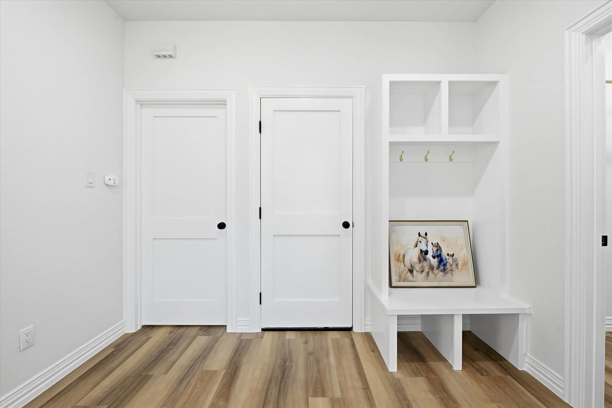 Mudroom with light wood-type flooring