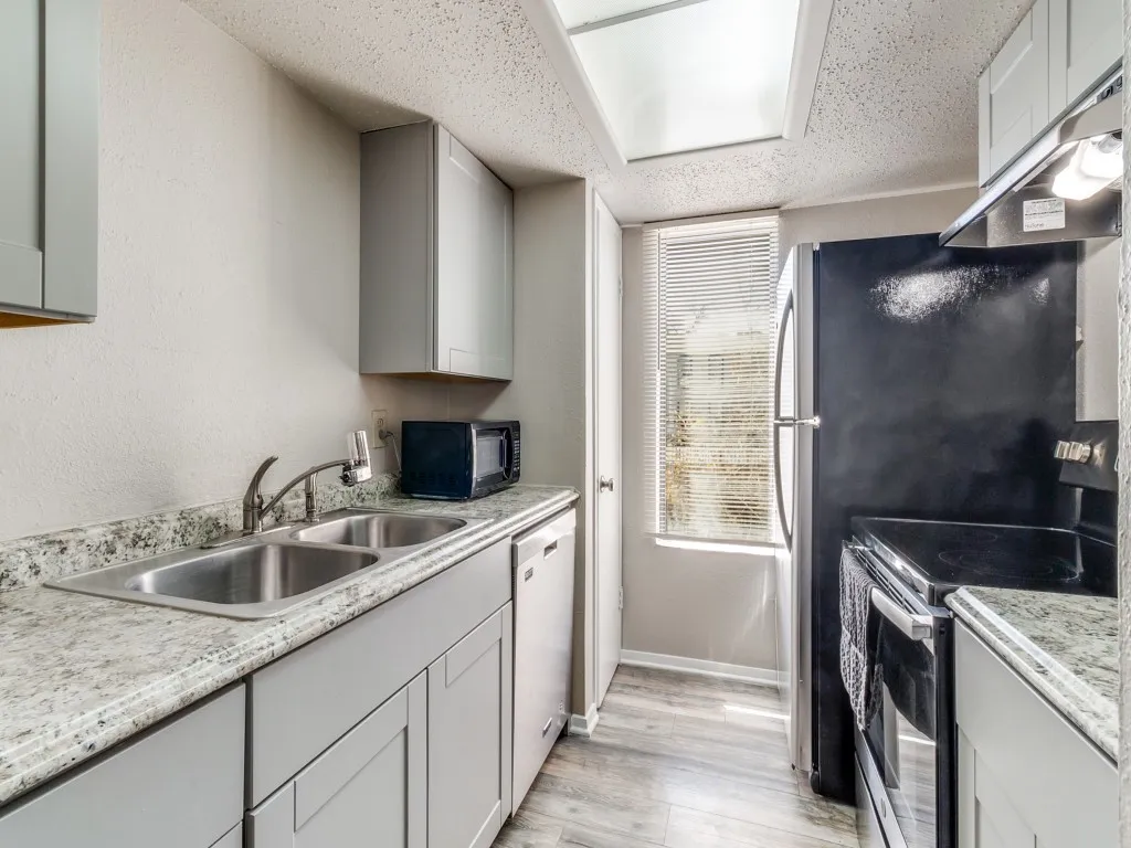 Updated kitchen with stainless appliances and fridge is included