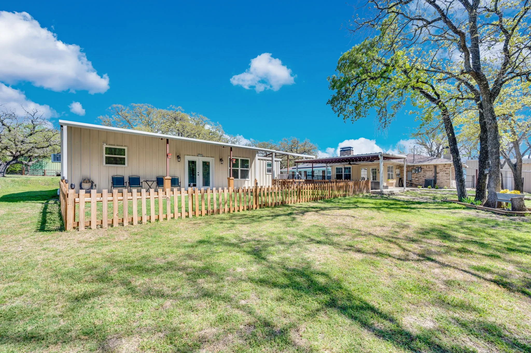 Front porch of Barndominium; Full living room, kitchen, dining room, bedroom, full bathroom with shower, and bonus space for extra guests or office space.