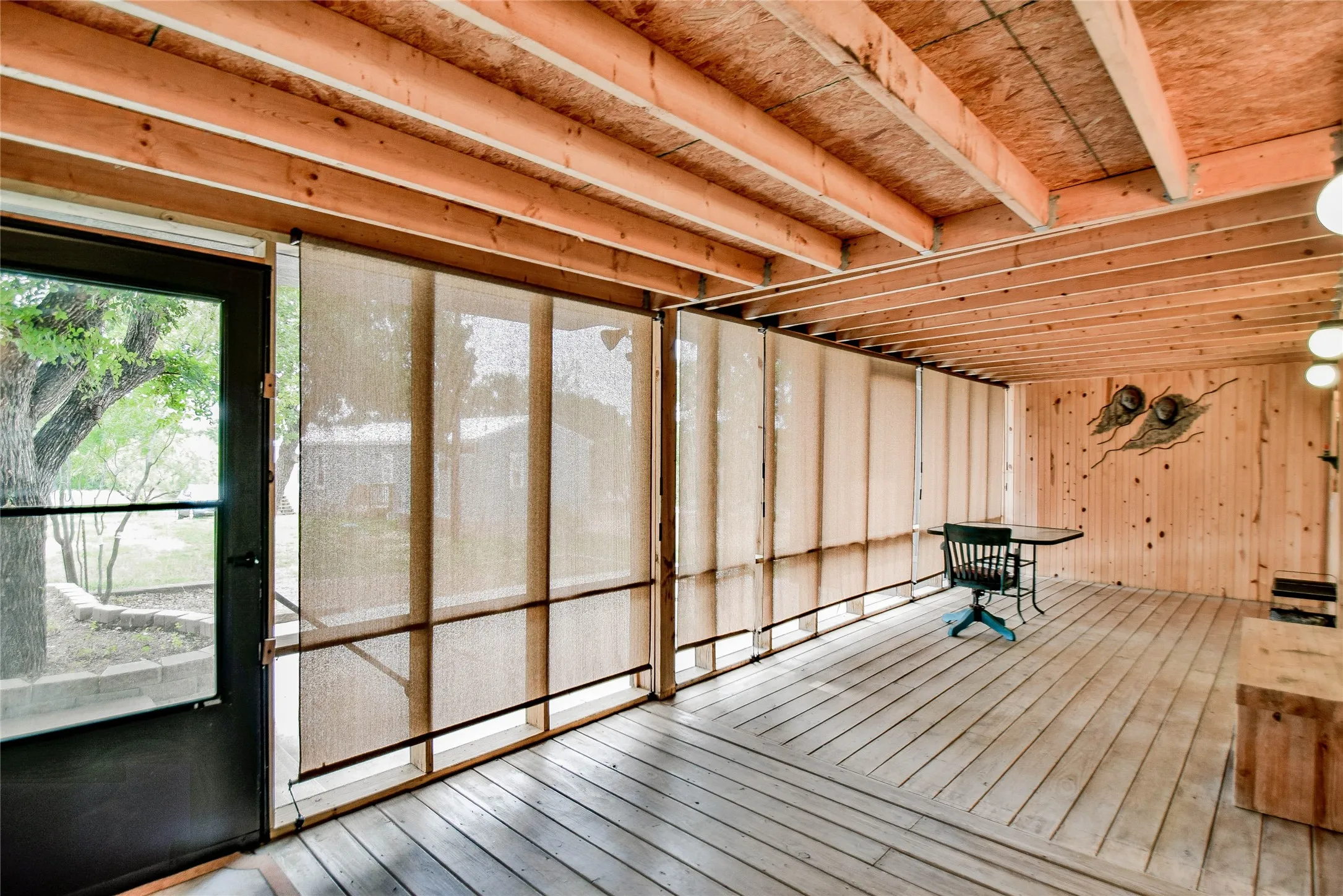Wonderful back deck with beautiful wood floors and pull-down blinds. Great place to eat and play card games!
