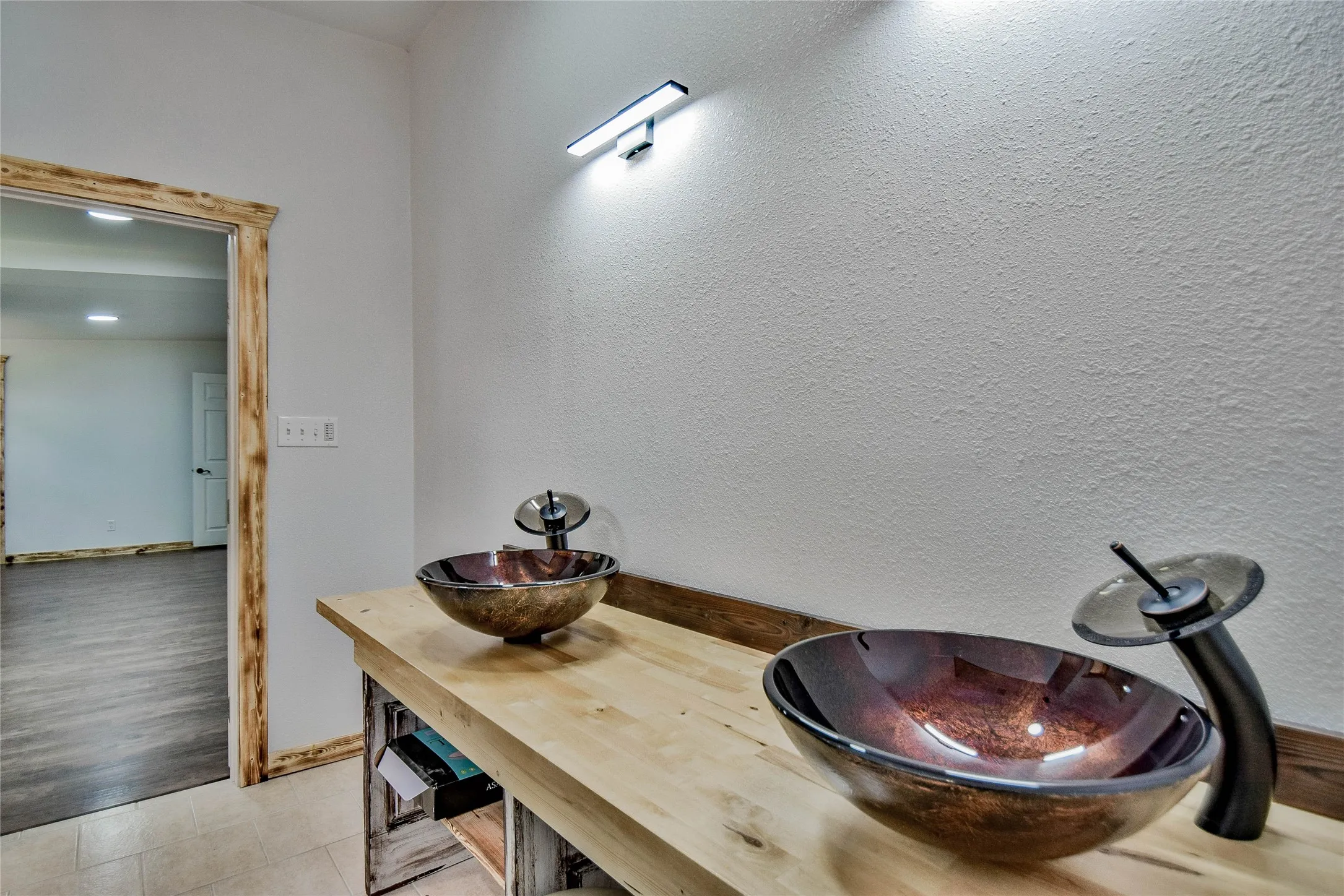 Great en-suite primary bathroom features modern tempered glass vessel sink, wood countertop and one of a kind vanity. Easy to be spoiled by keeping your bath towel warm with the towel warming feature!