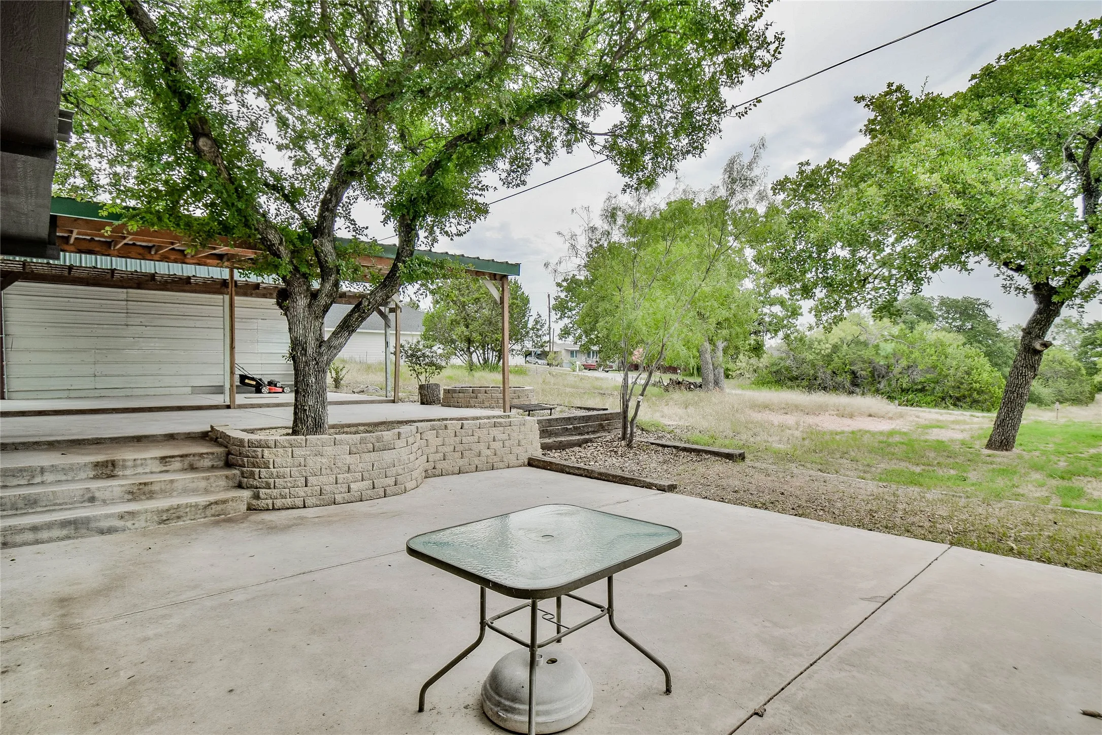 View of patio and carport - lots of room for relaxing outside.