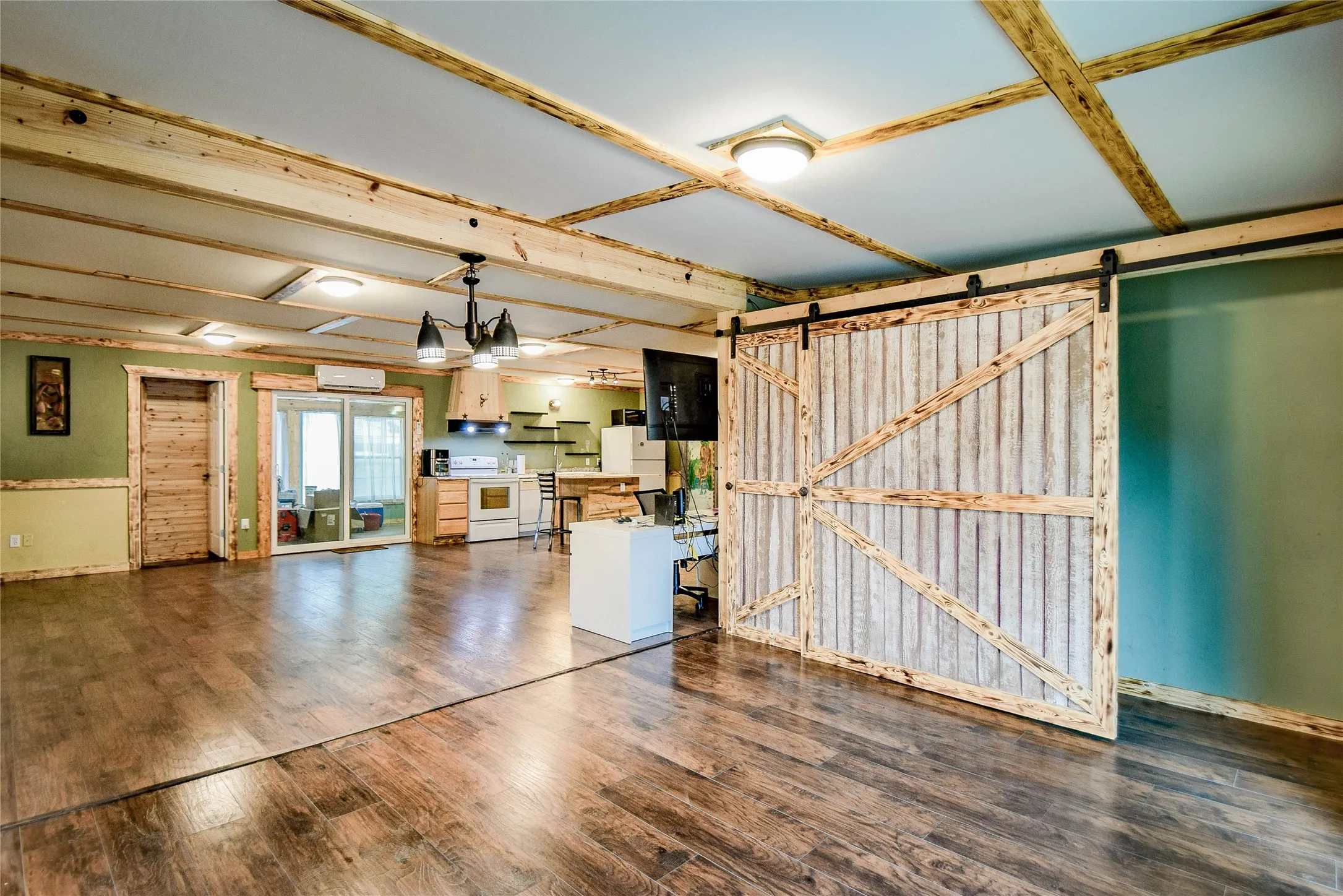 Extra living area can easily turn into an office or separate family space. Great sliding barn doors provide ample storage area.