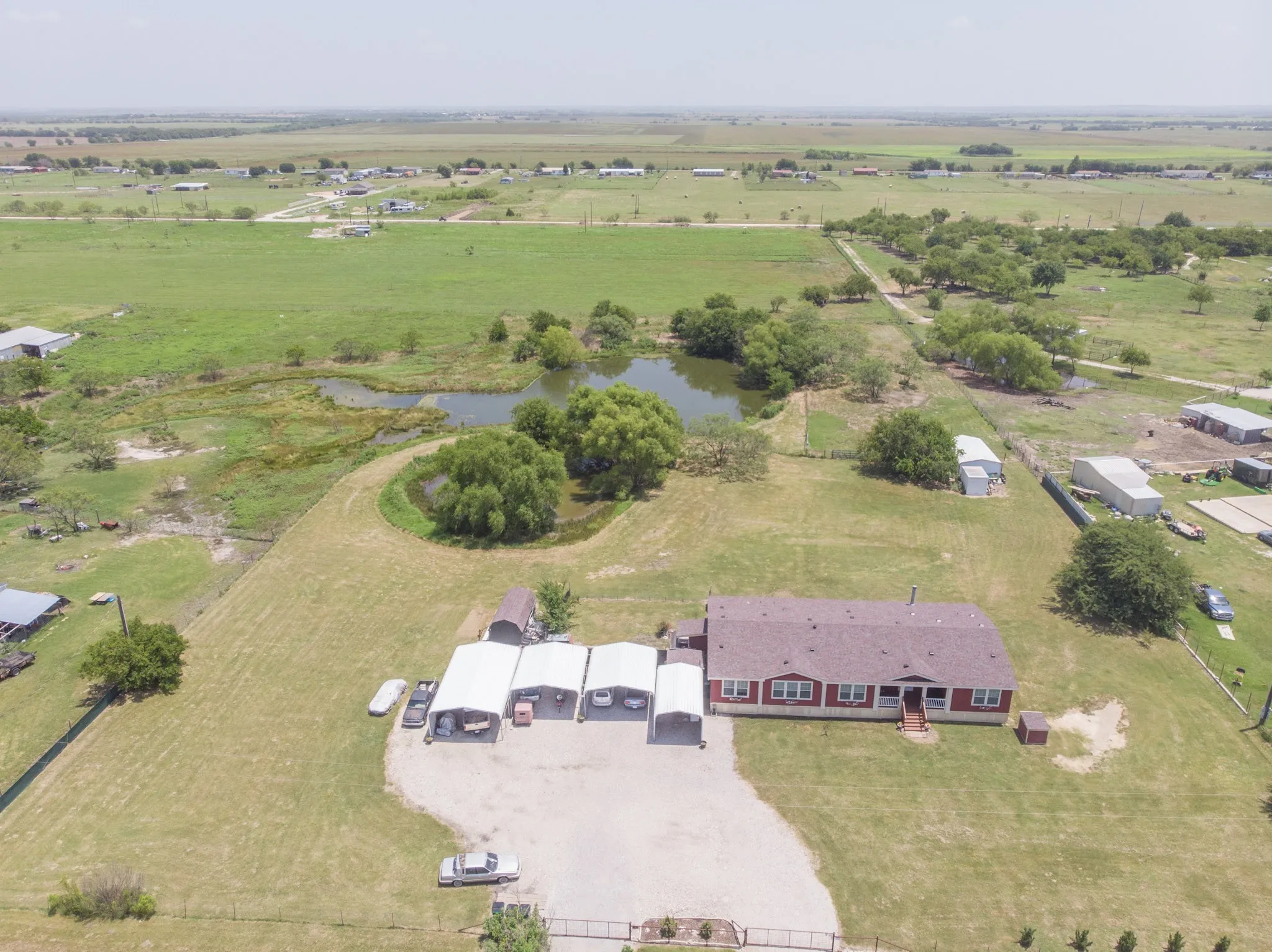 A birds eye view of the expansive fenced property