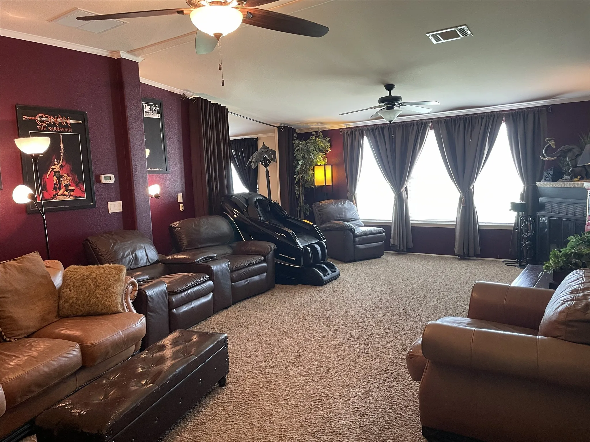Spacious media room with custom wall color for better viewing experience.