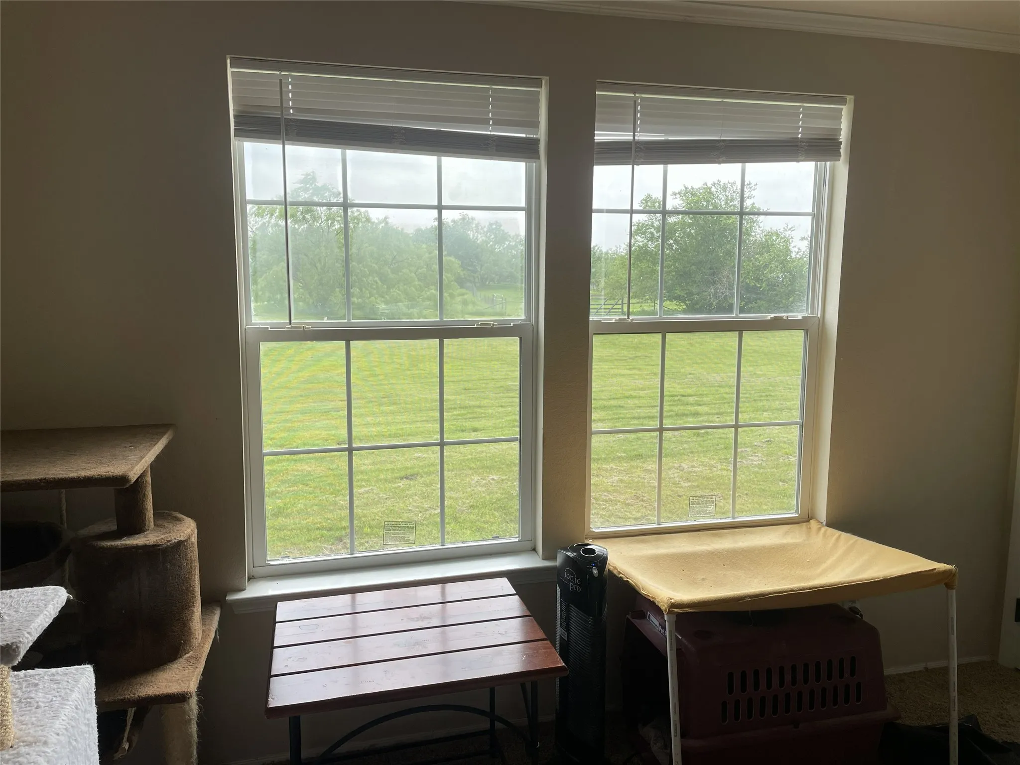 The 4th bedroom is being used as a business file room & storeage area. It has a walk in closet with a great view of the pasture & ponds.