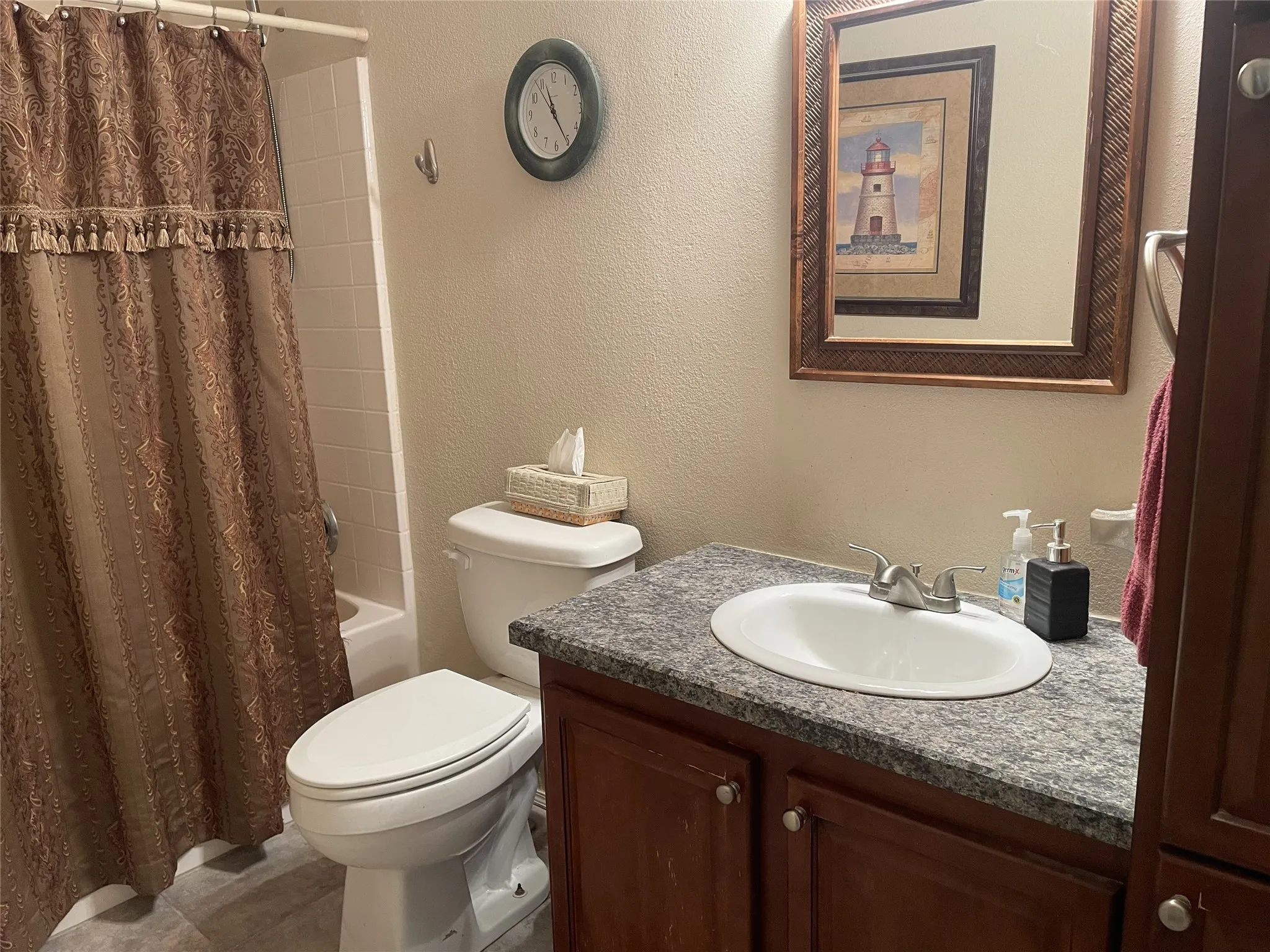 This guest bathroom sits between the two guest bedrooms for convenience with a tub/shower combination & a linen closet