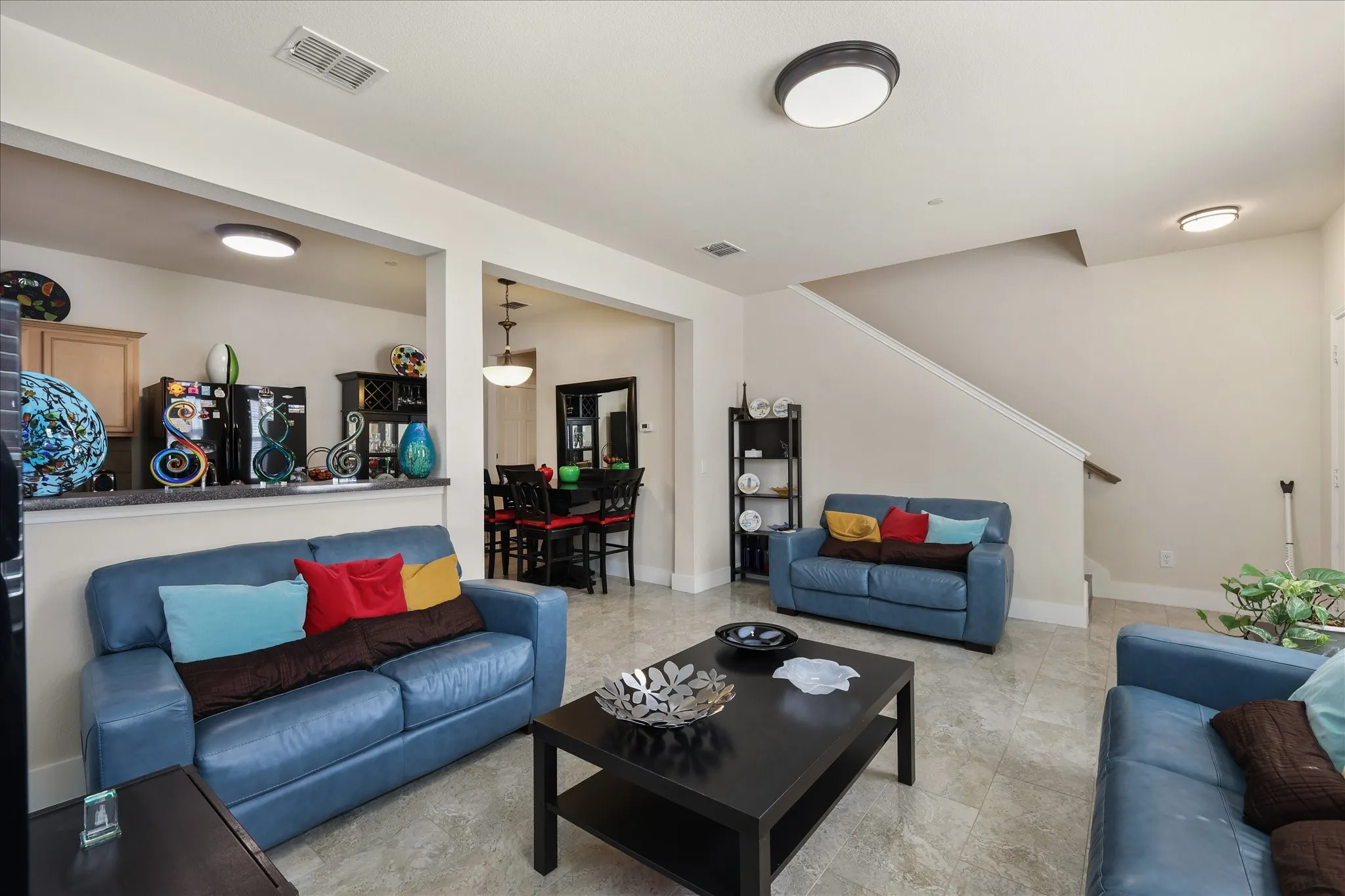 Living area featuring stairs and baseboards