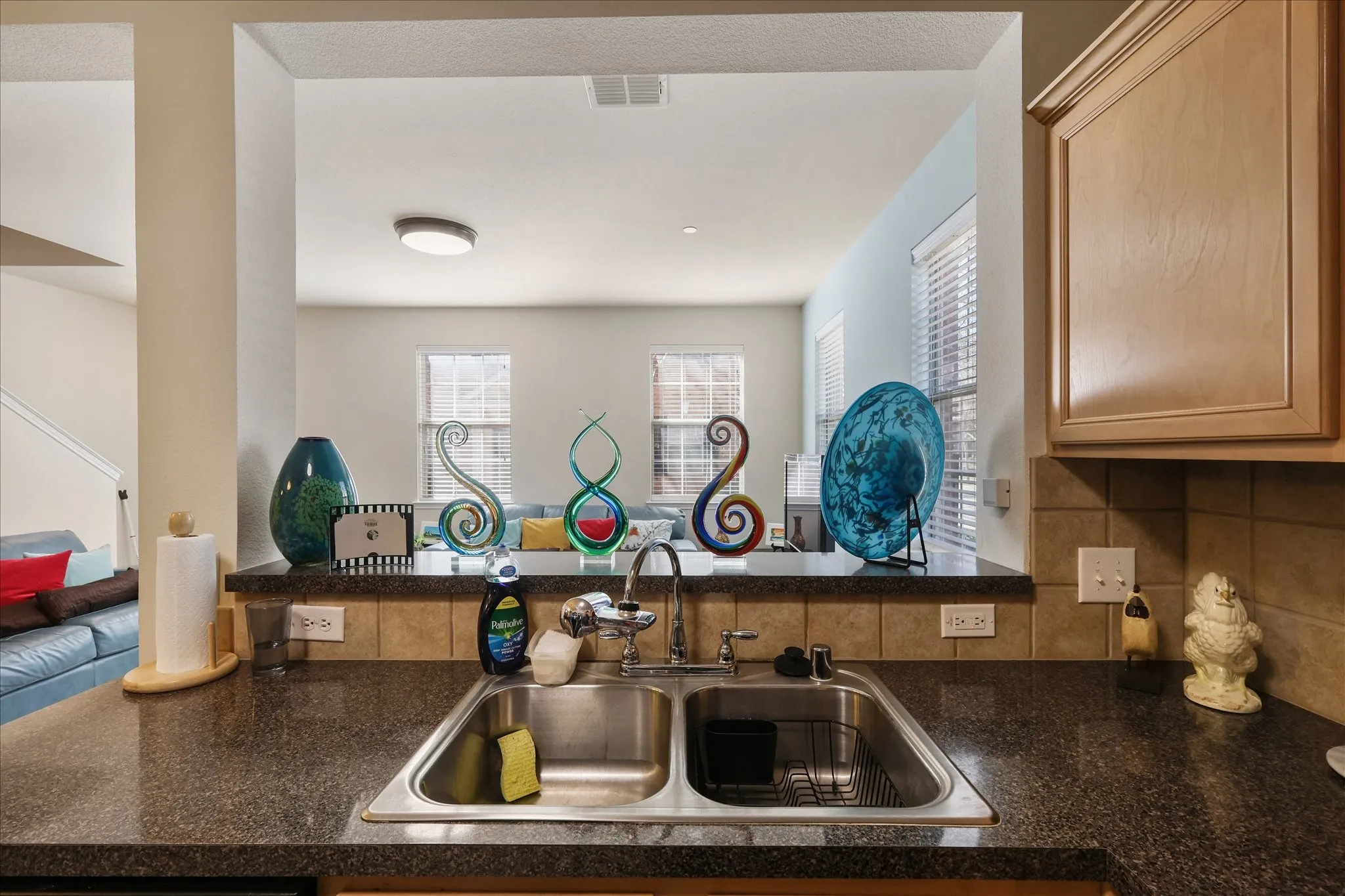 Kitchen featuring a sink and tasteful backsplash