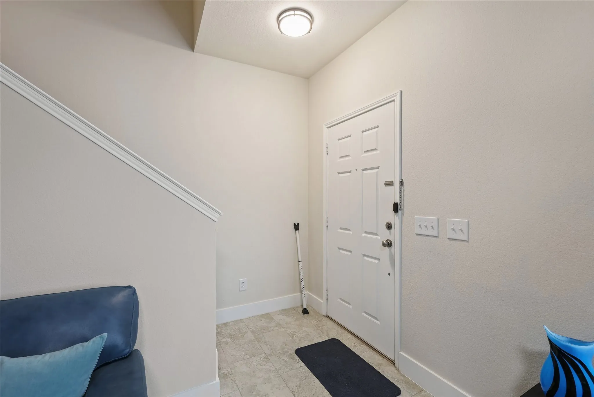 Foyer entrance featuring baseboards