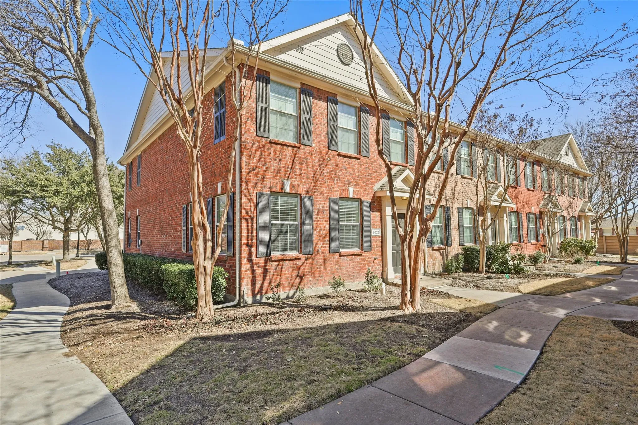 View of front of property featuring brick siding
