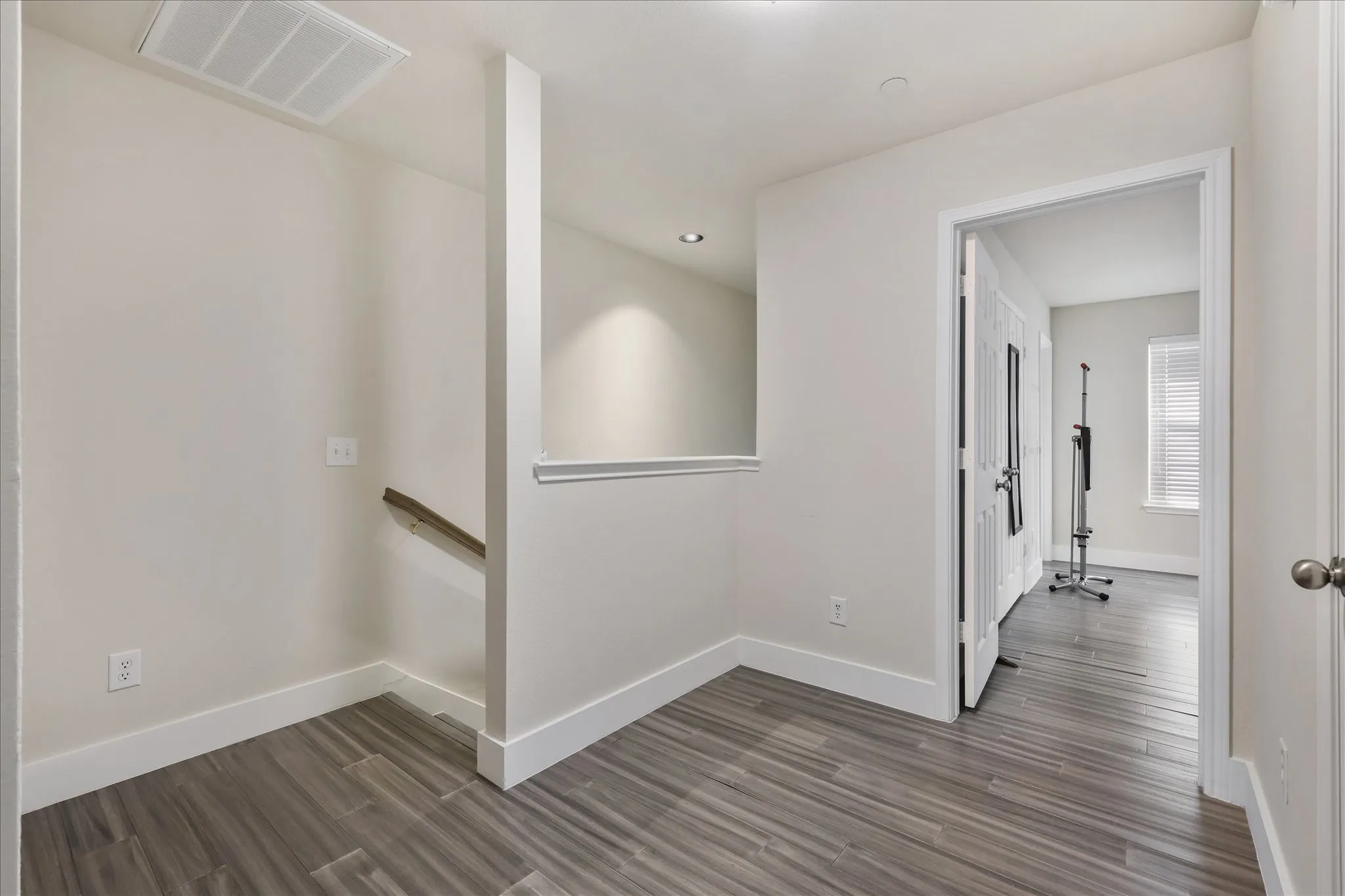 Hall featuring baseboards and dark wood finished floors