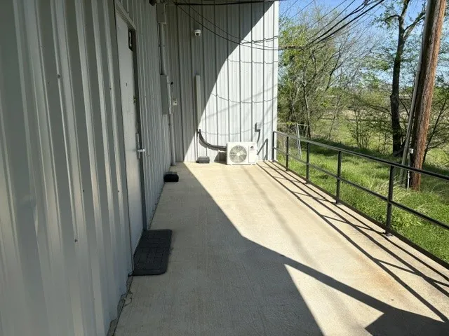 Back covered patio with view of mini-split for the SRO office.