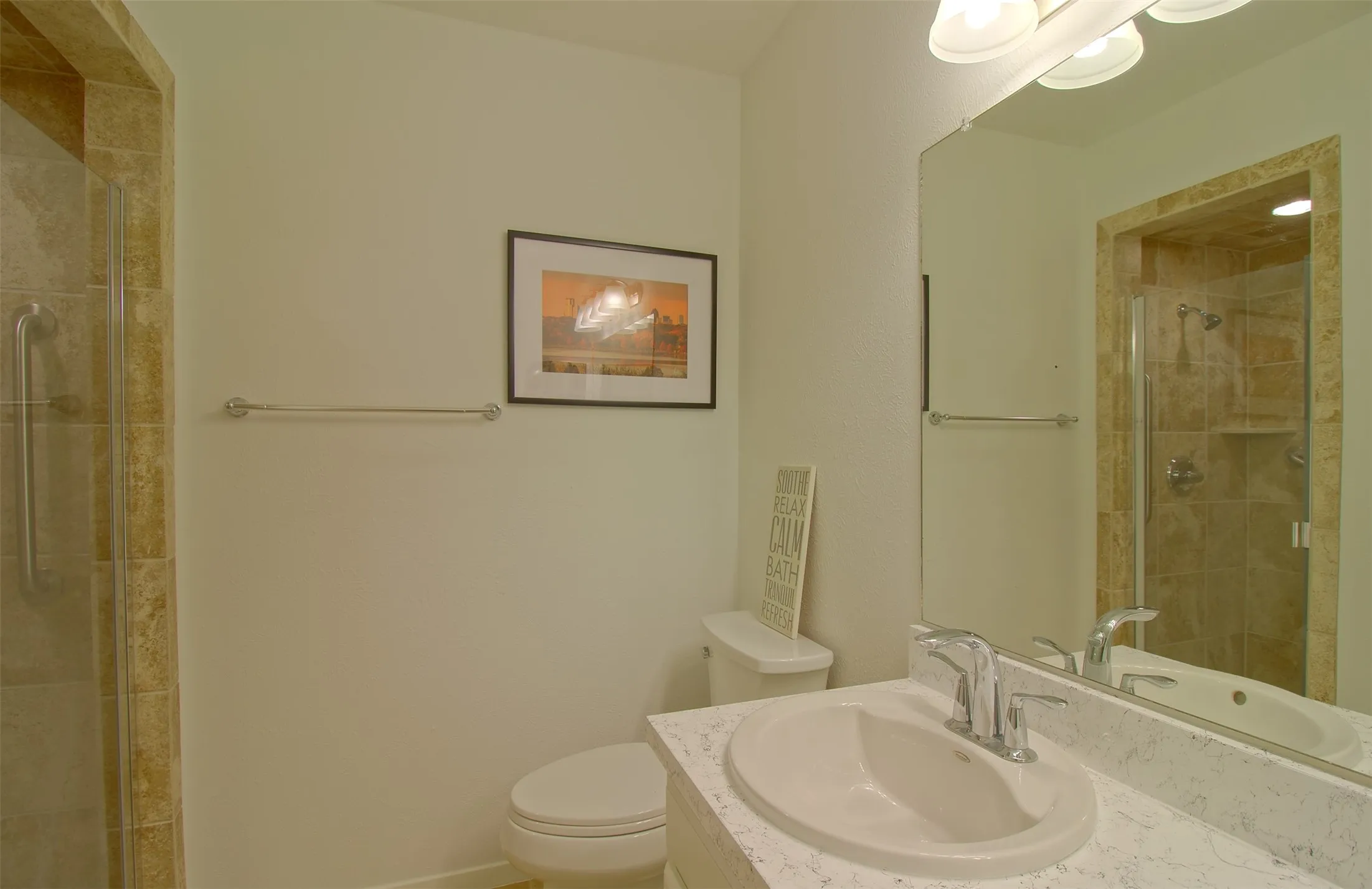 Full bath with a stall shower and vanity