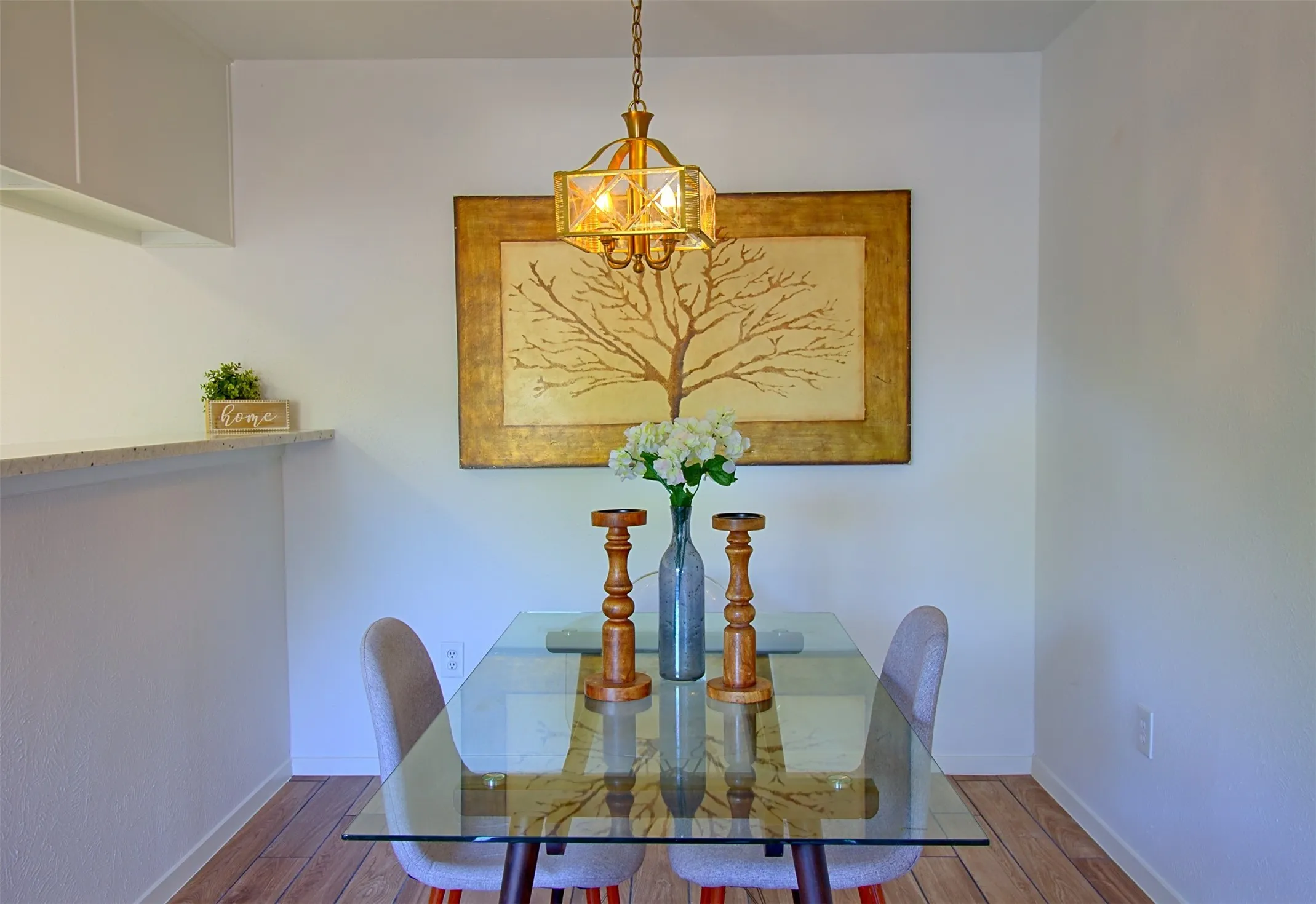 Dining room featuring wood finished floors and hanging lights