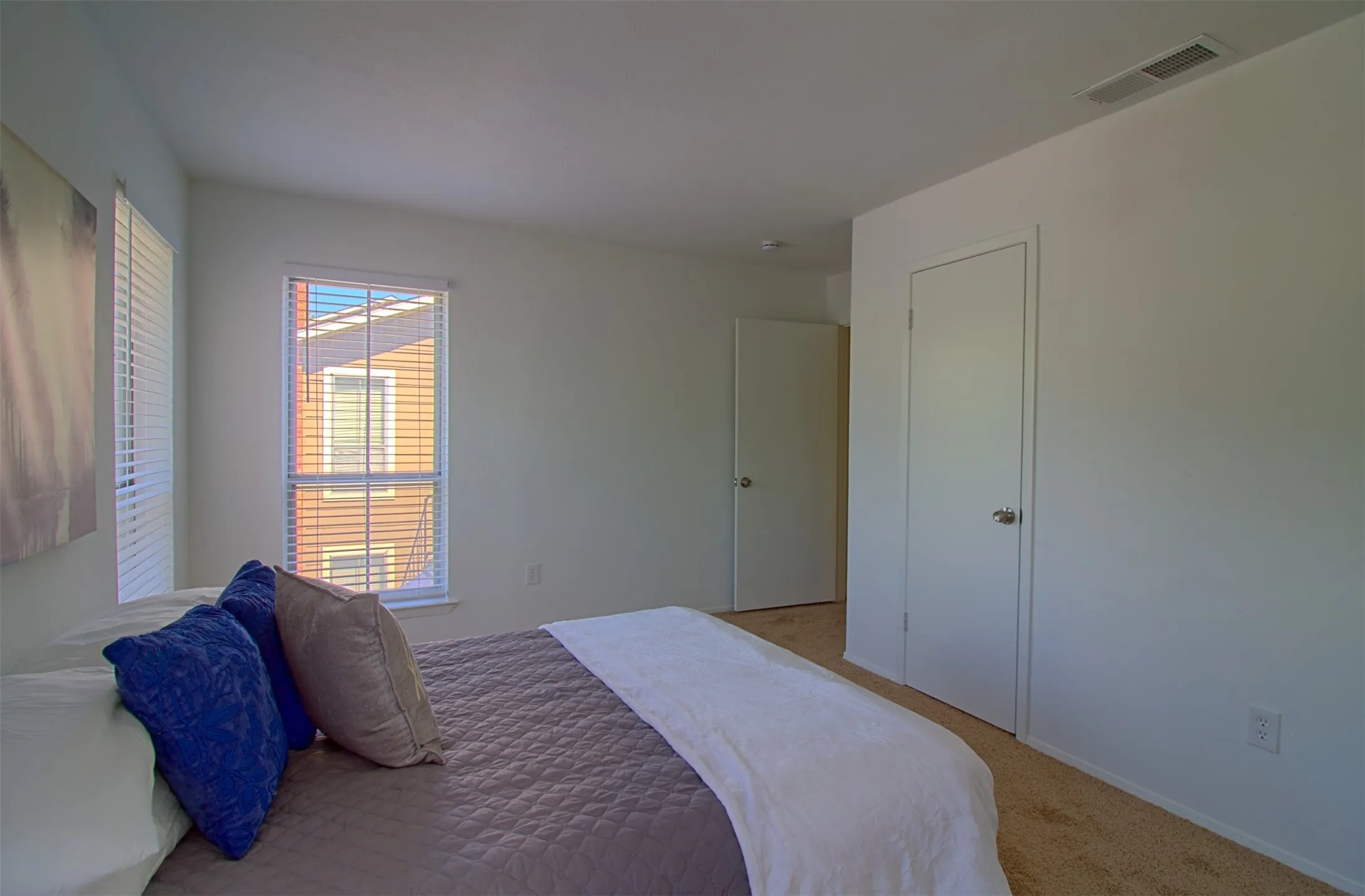 Carpeted bedroom featuring baseboards