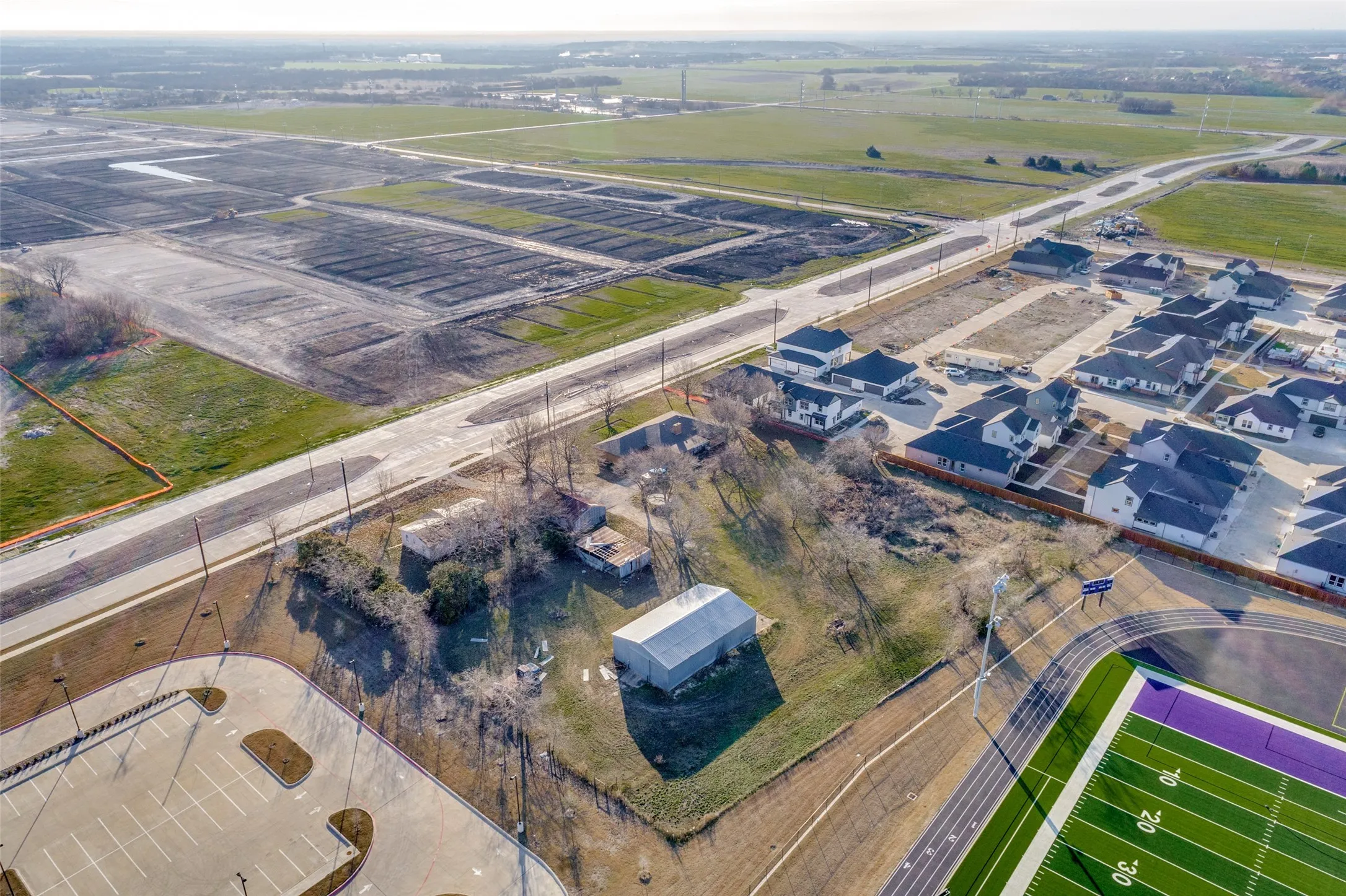 January 2025 - Facing Southeast. Leonard is now 4 lanes open to the Outer Loop. Development across the street is also underway.